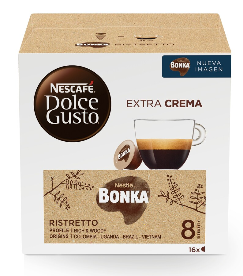 Caja de cápsulas de café con taza y cápsula de café.