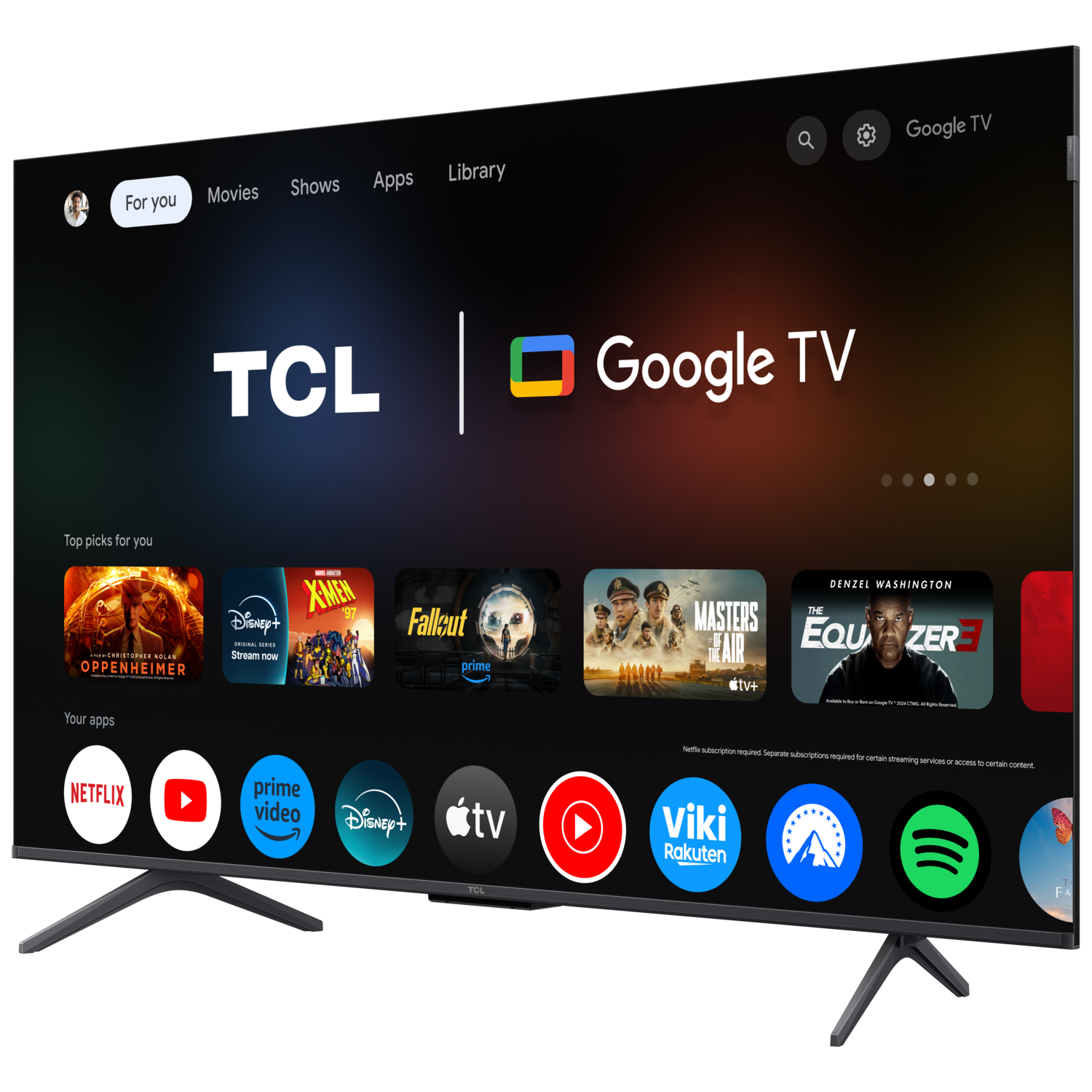 TCL Google TV interface. Apps and movie icons visible. Black stand, black frame TV.