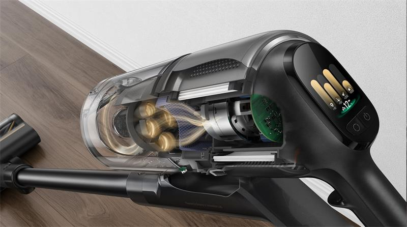 Przekrój czarnego odkurzacza, pokazujący elementy wewnętrzne, jak silnik i przepływ powietrza.