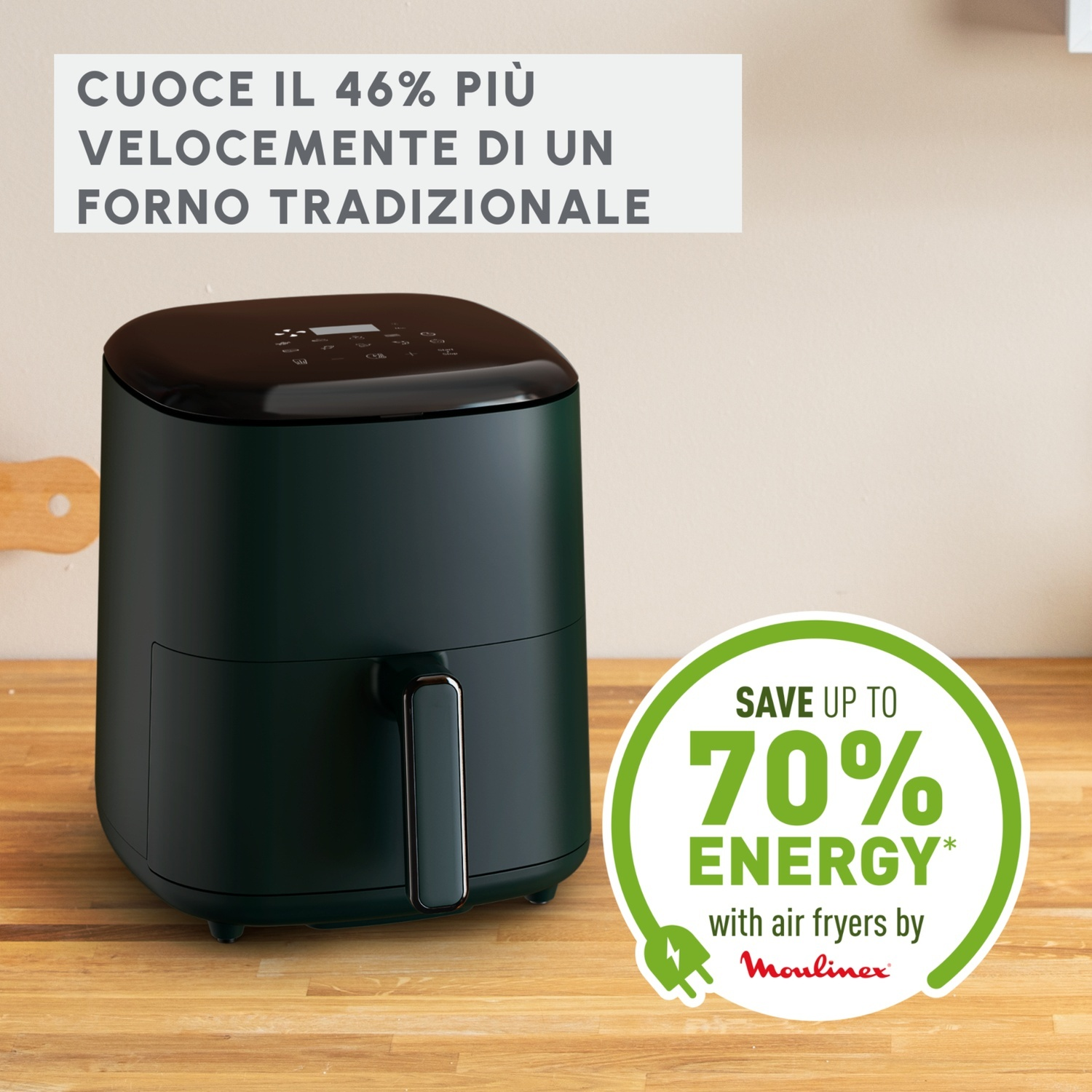 Una friggitrice ad aria verde scuro su un tavolo di legno.