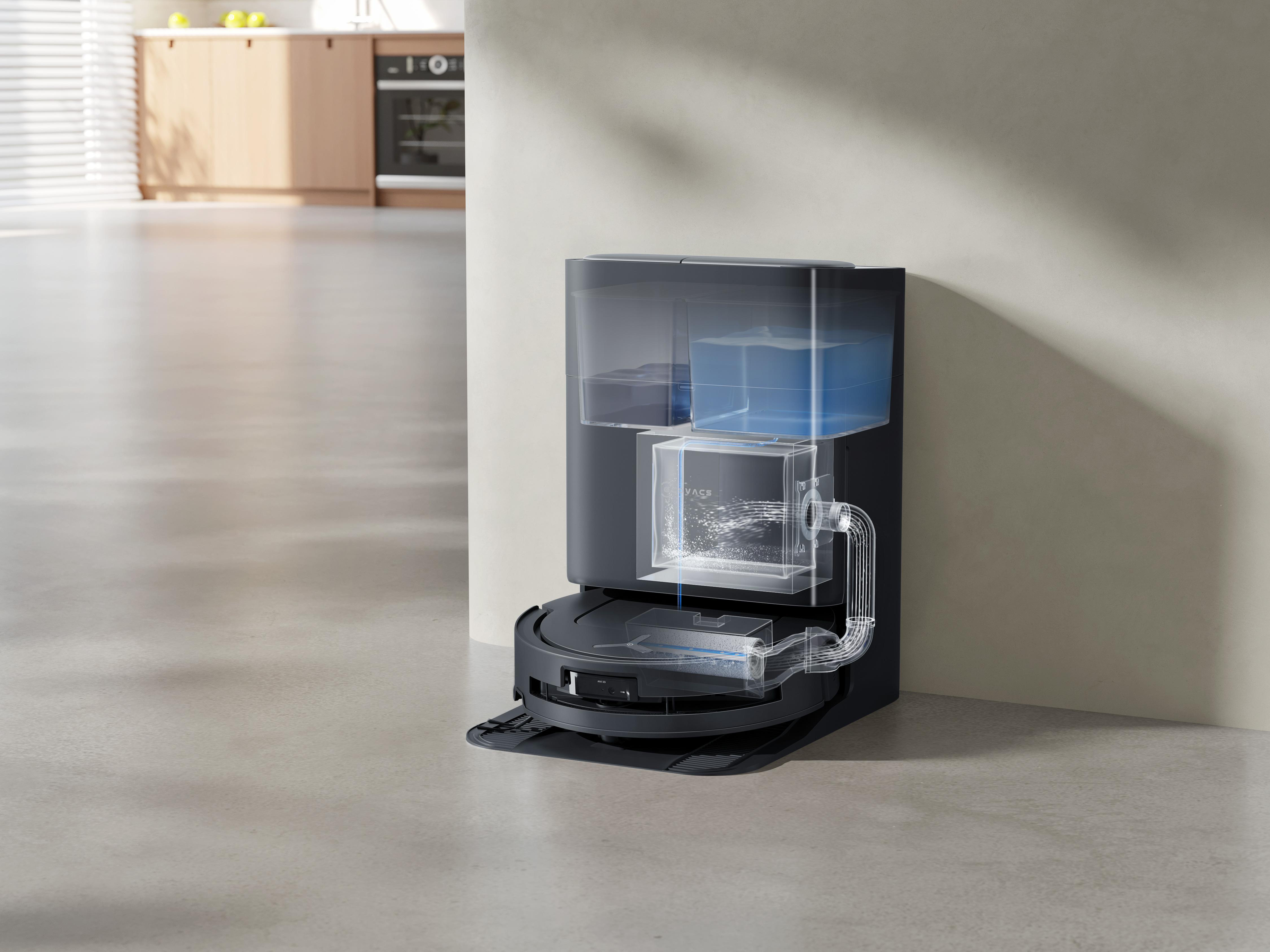 Roboter-Staubsauger mit Wassertanks und transparenten Abschnitten, in einer modernen Küchenumgebung.