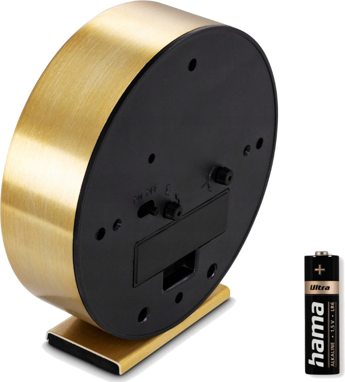 Złoty budzik z baterią, czarną podstawą i włącznikiem/wyłącznikiem.