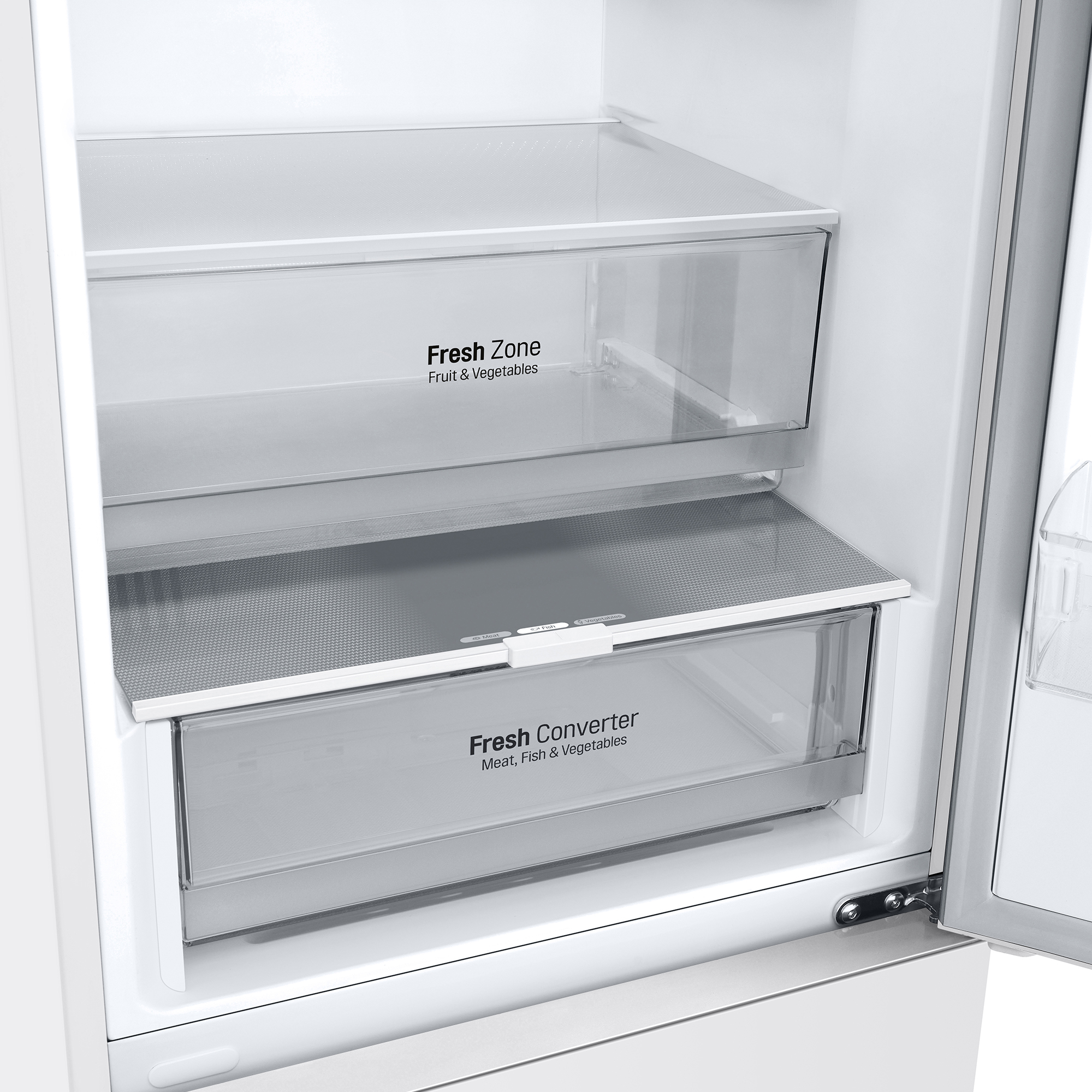 Primer plano del interior de un refrigerador con dos cajones transparentes, etiquetados como 'Fresh Zone' y 'Fresh Converter'.