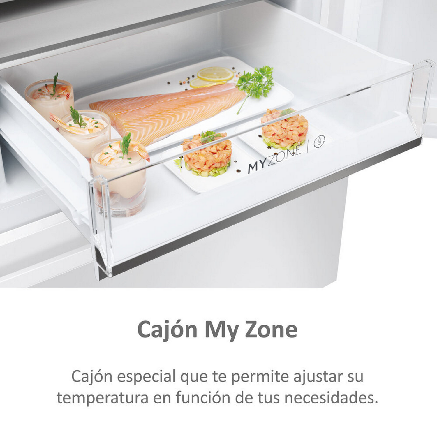 Cajón de refrigerador con comida dentro: salmón, camarones y otros aperitivos.