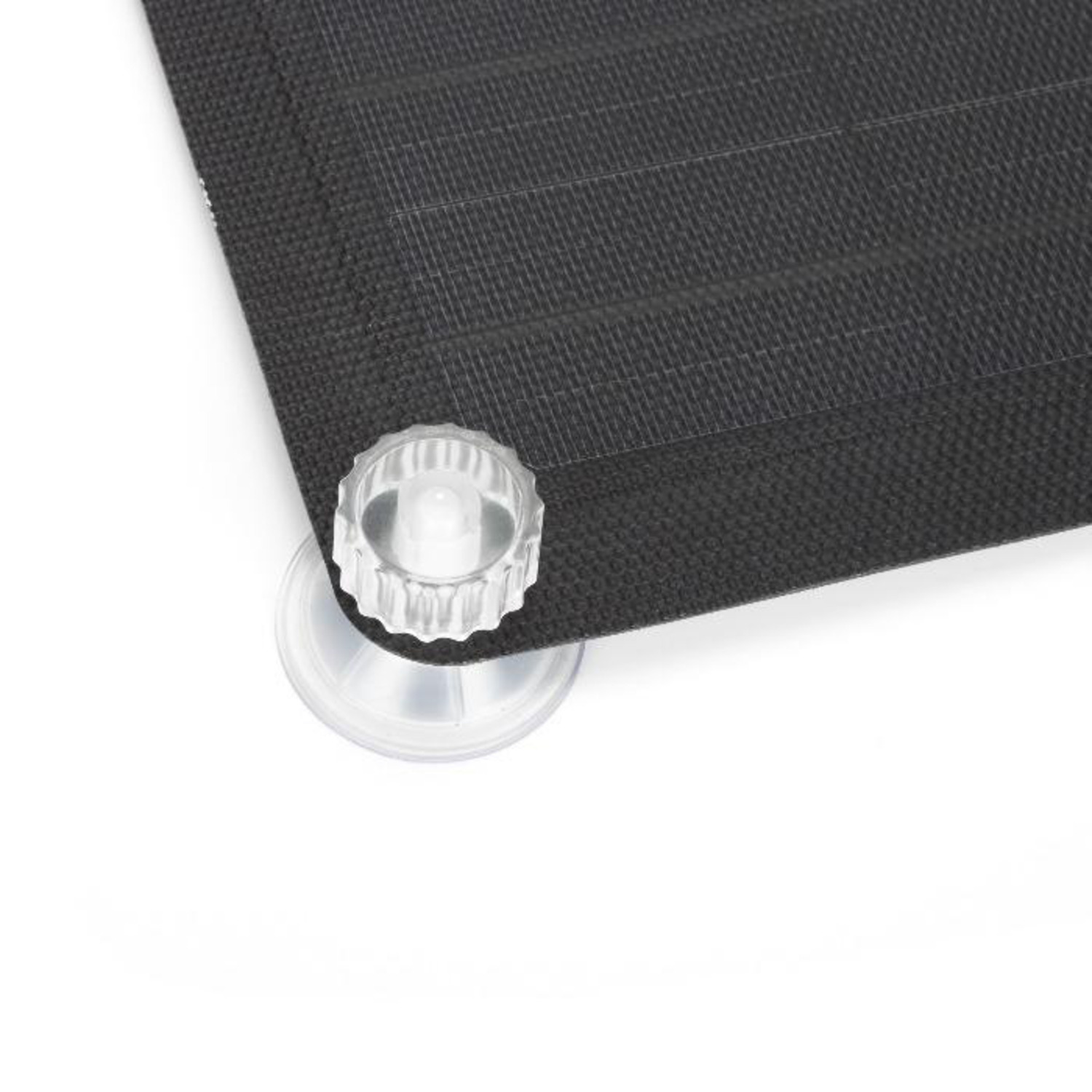 Close up of a black mat with a suction cup. White background and a corner of mat.