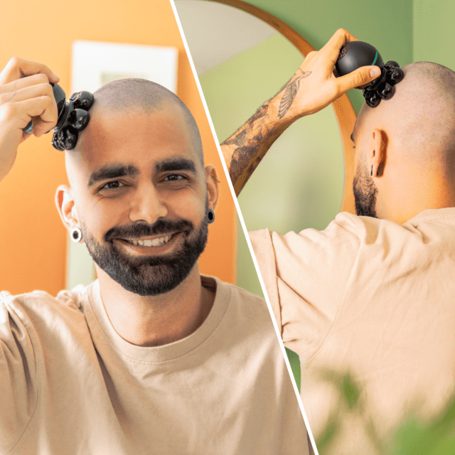 Mężczyzna goli głowę golarką. Mężczyzna uśmiecha się i patrzy w kamerę.