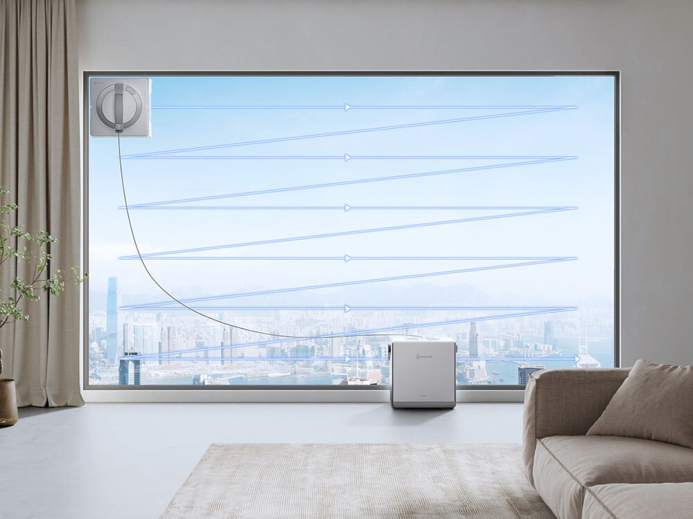 Robot do czyszczenia okien myjący duże okno z widokiem na miasto.