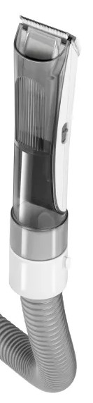 Zbliżenie maszynki do włosów z przystawką do odkurzacza.