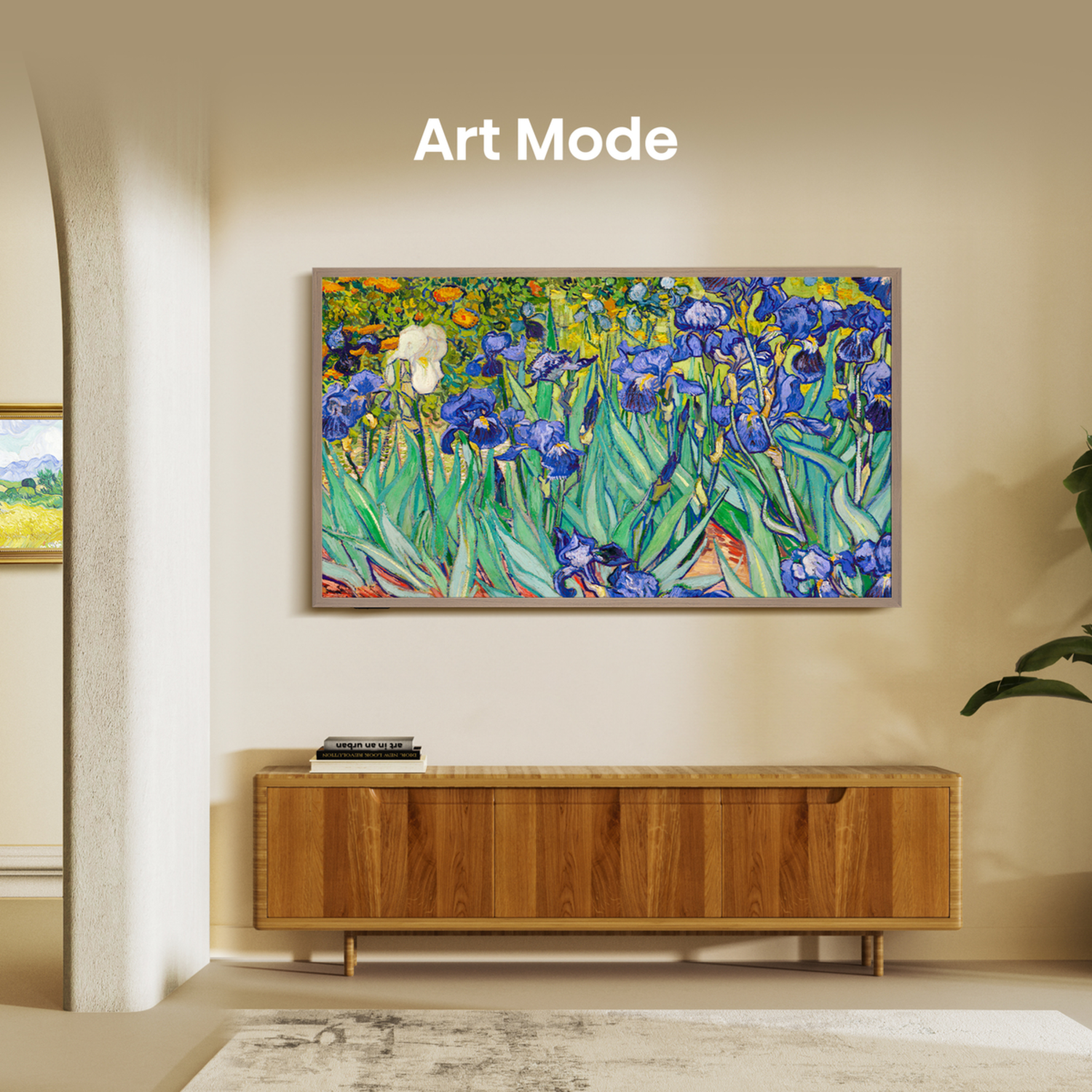 Painting of blue irises in a wooden frame. A wooden cabinet is below the painting. A rug and plant are in view.