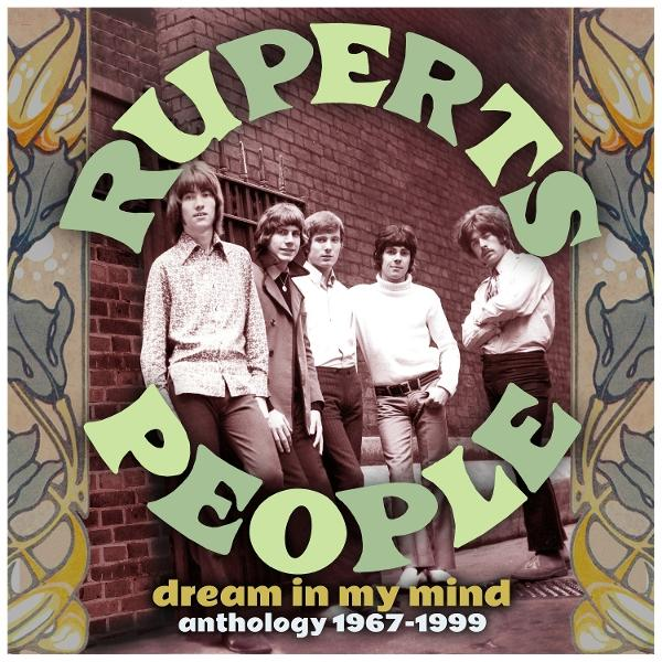 Albumcover: Band 'Rupert's People'. Bandmitglieder vor Backsteinmauer, Blumendesign.