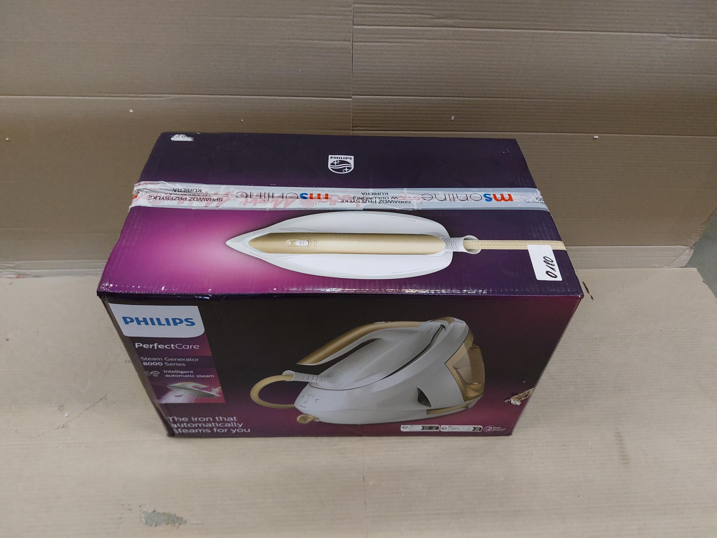 Pudełko żelazka parowego Philips PerfectCare ze złotymi elementami.