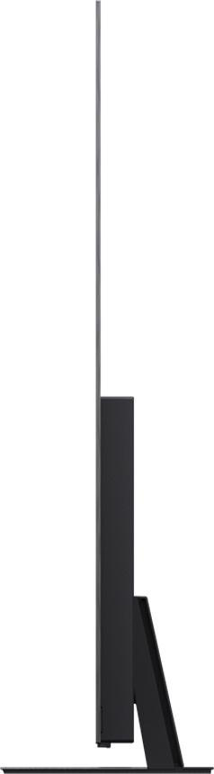 Eine gut beleuchtete Schlafzene mit Lampe, Vase und einem weißen Luftbefeuchter.