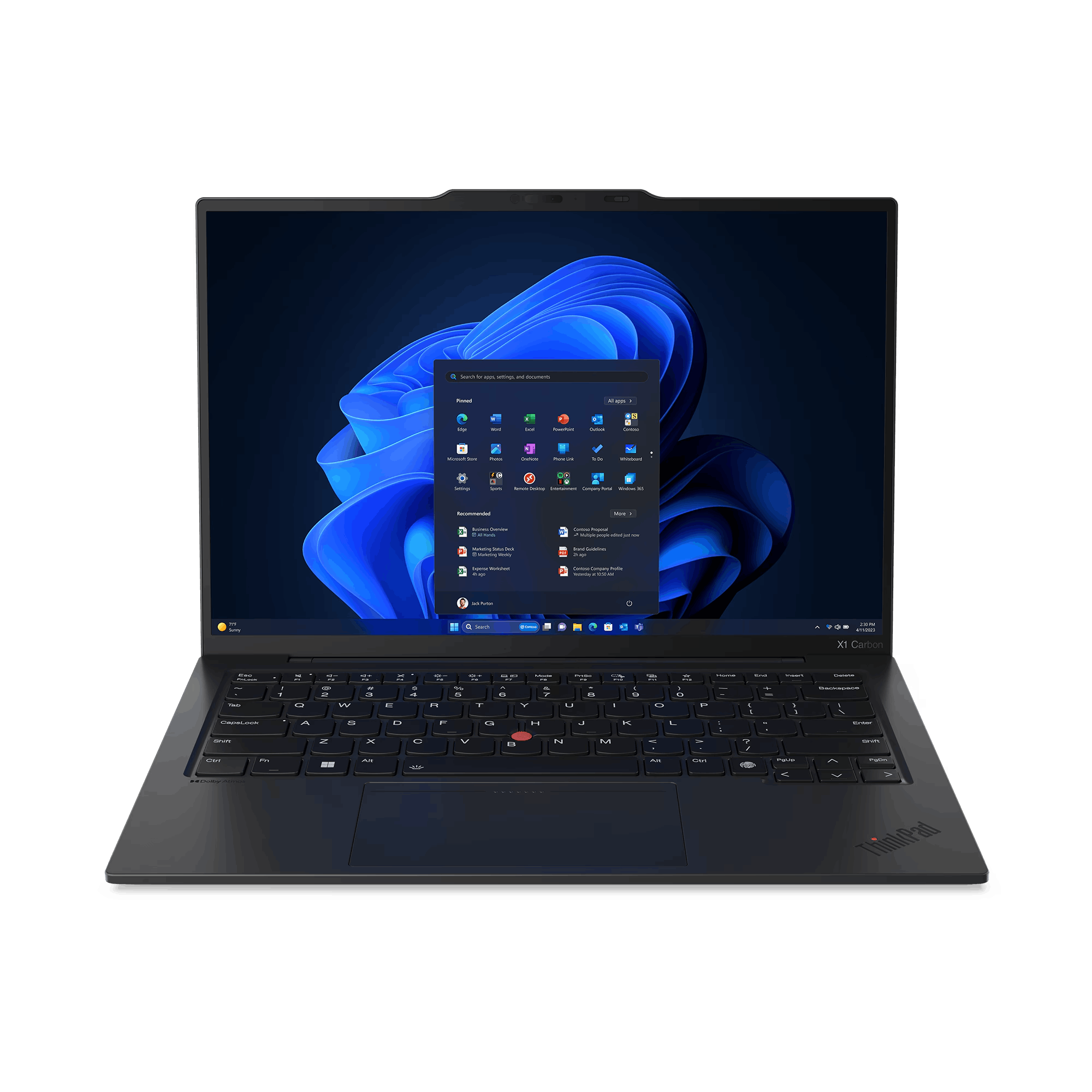 Ordenador portátil sobre una superficie negra, mostrando el escritorio de Windows 11 con iconos de aplicaciones.