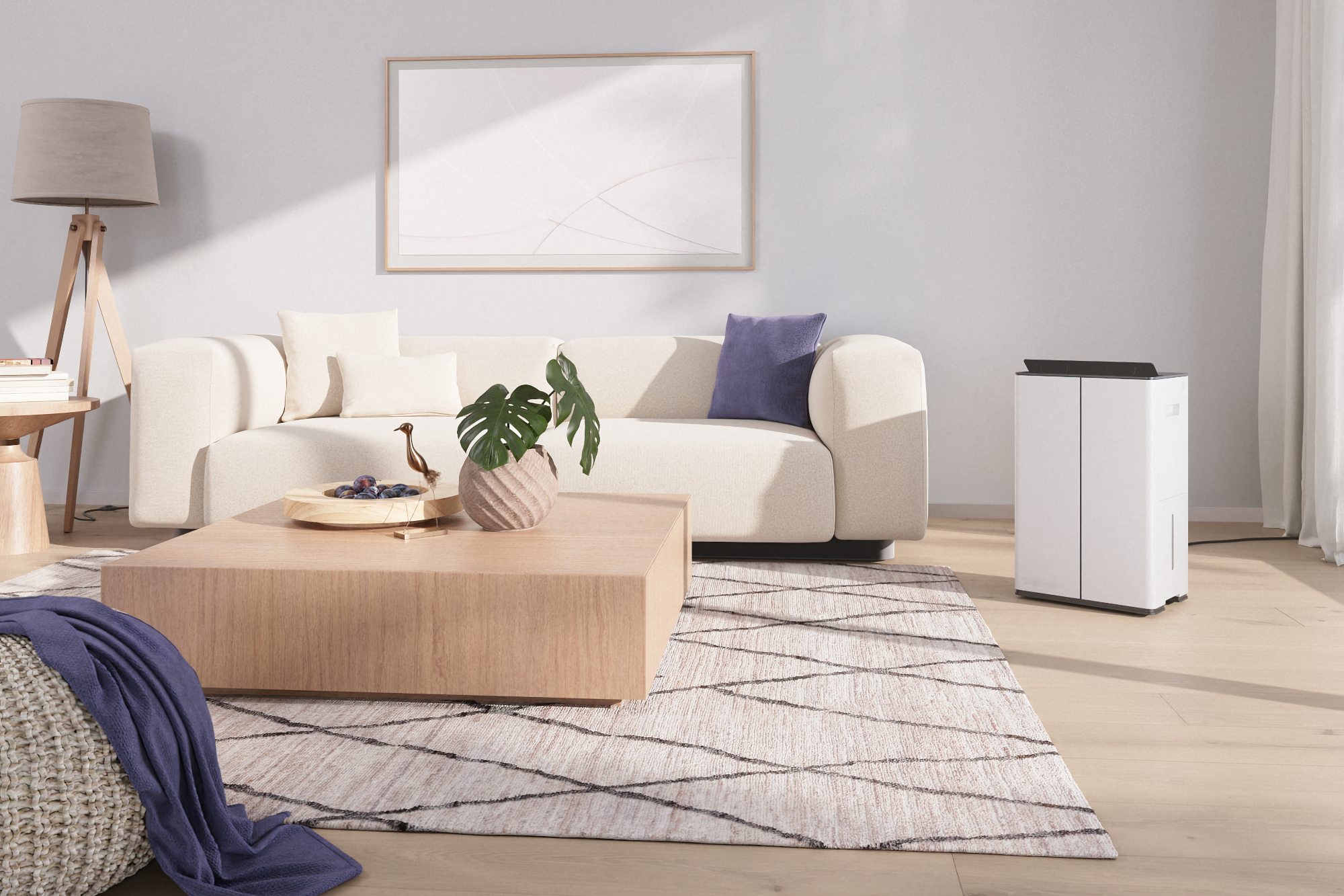 Un moderno soggiorno con un divano bianco, un tavolino in legno e un umidificatore bianco.