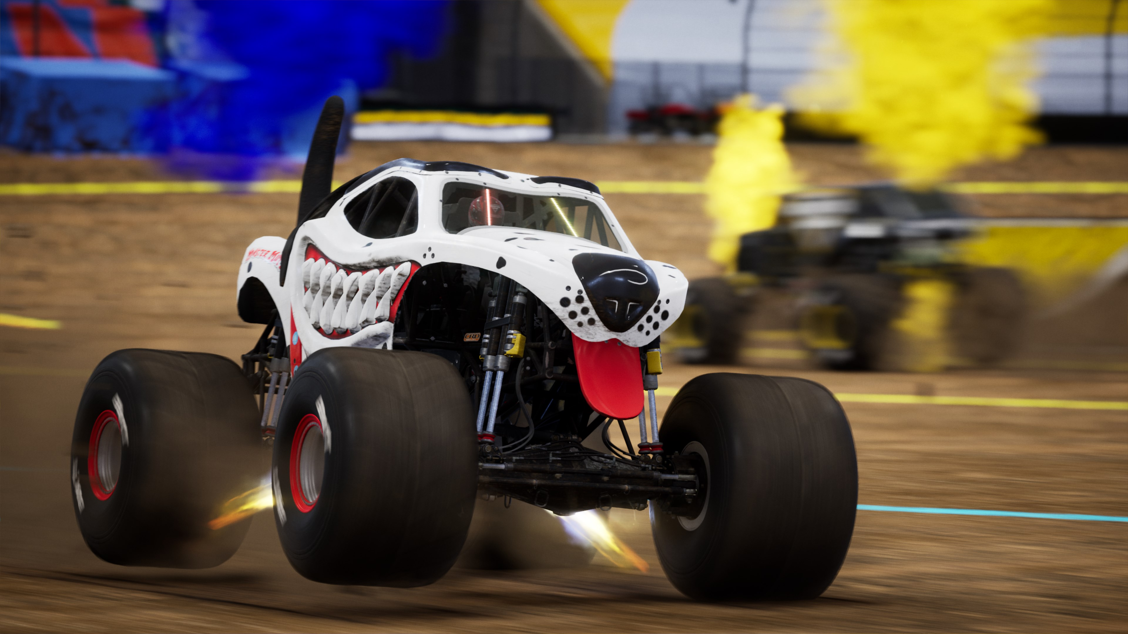Monster truck bianco con muso da cane, salta su pista sterrata.