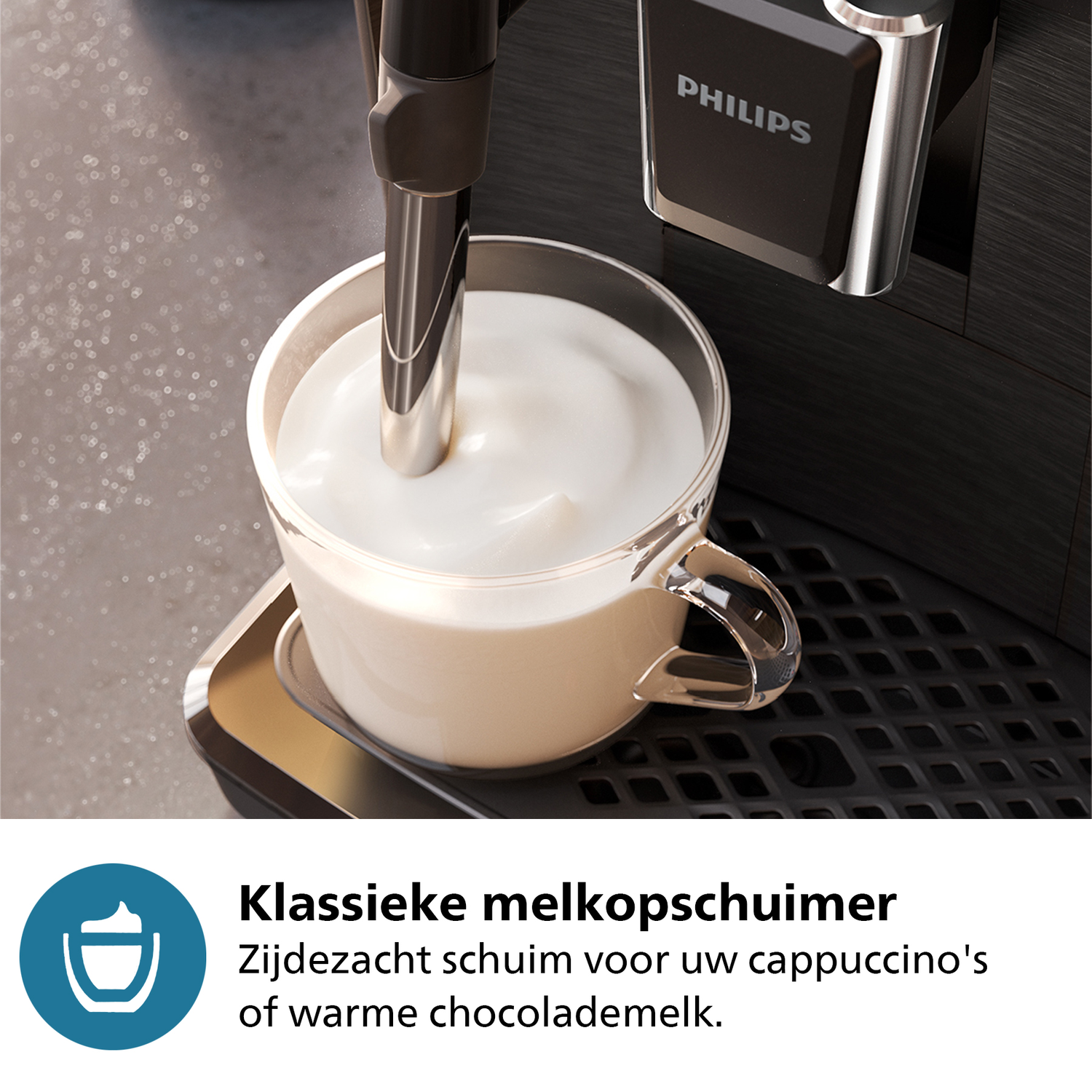 Coffee machine with foamy milk in a glass cup.