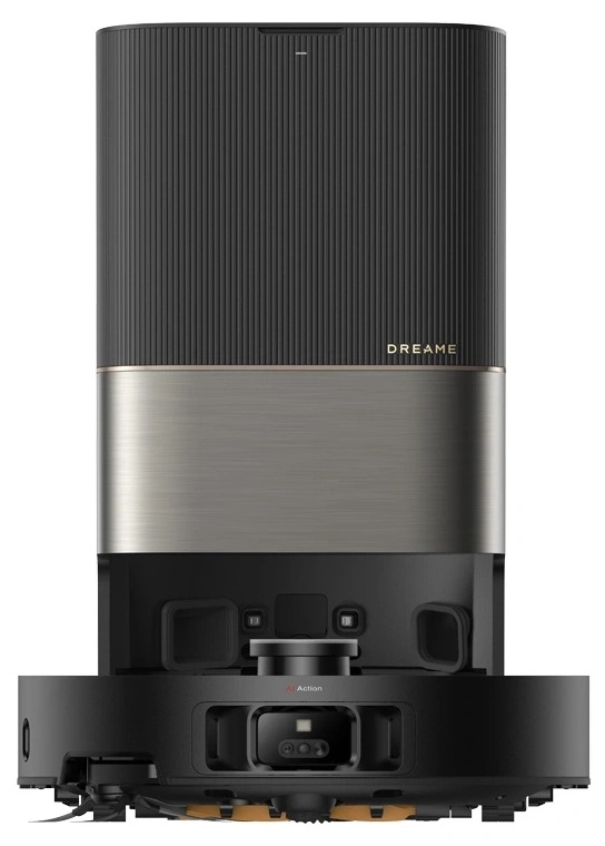 Czarny i szary odkurzacz stoi wyprostowany. Ma kwadratową podstawę i wysoki korpus.