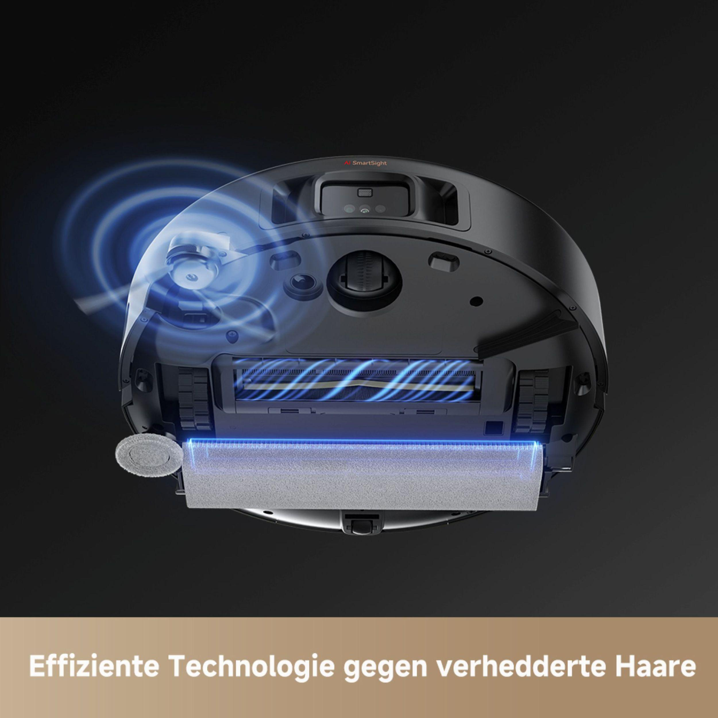 Unterseite eines schwarzen Roboter-Staubsaugers auf dunklem Grund.