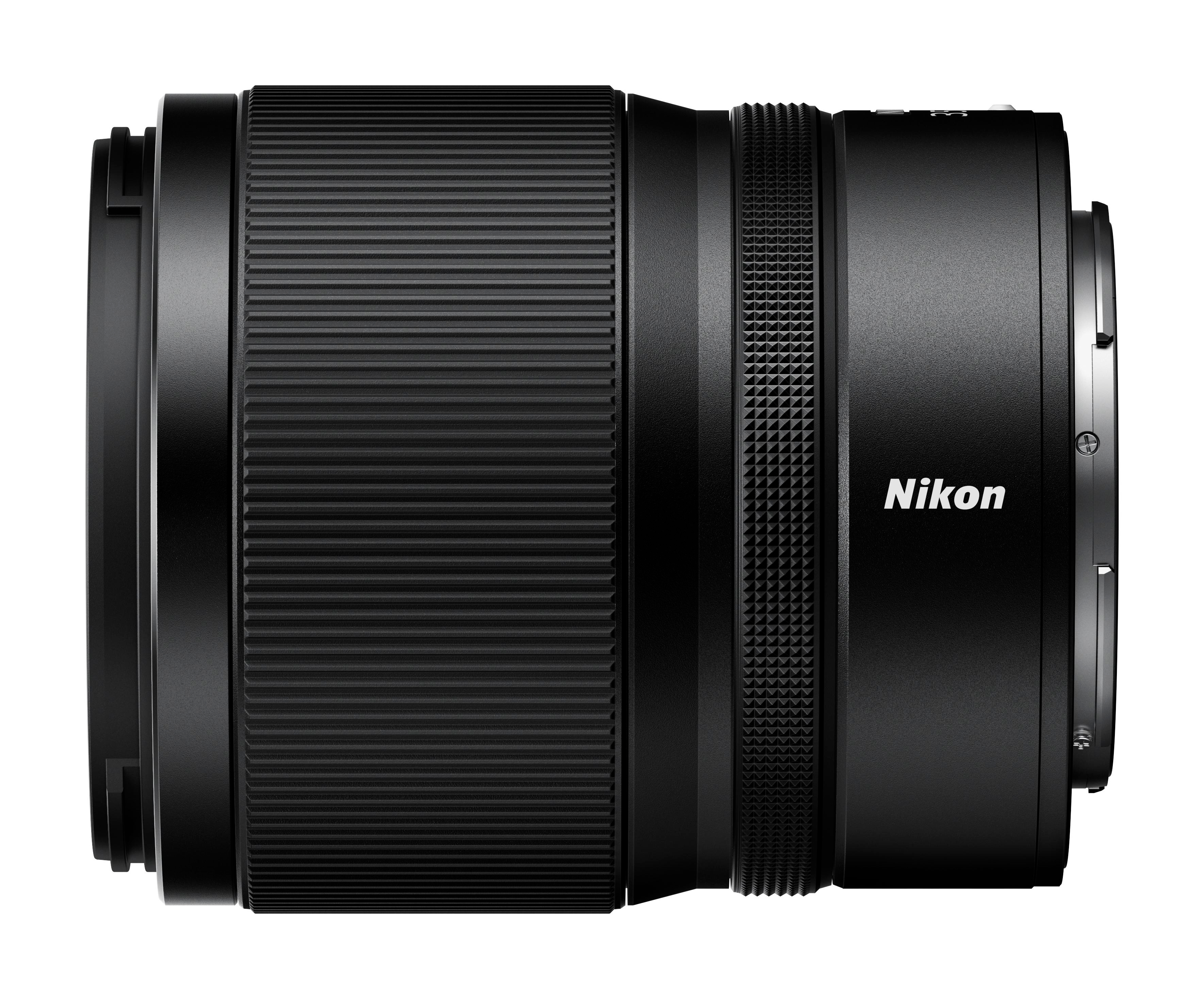 Schwarzes Nikon-Objektiv, Seitenansicht, geriffelter Körper, Nikon-Text.