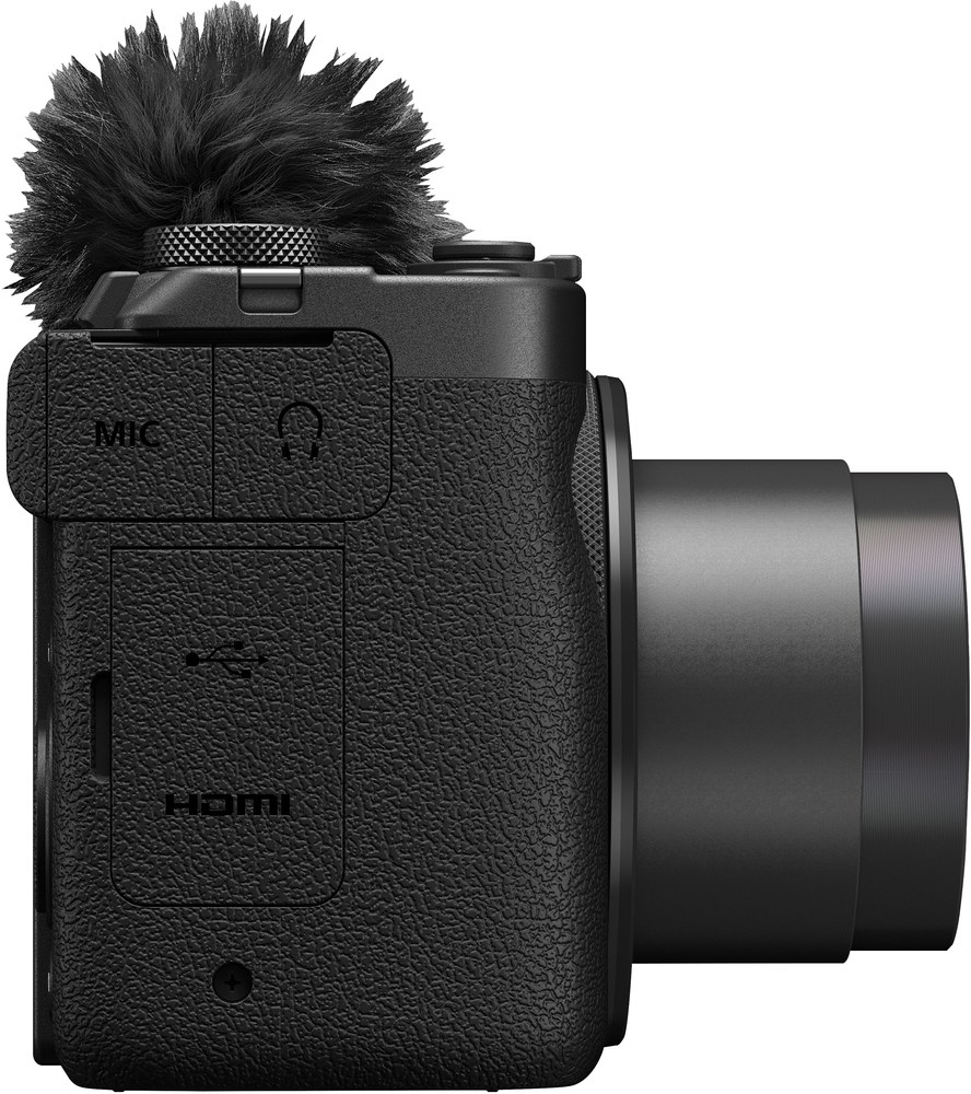 Fekete kamera mikrofonnal. Oldalnézet, mikrofon és HDMI port látható.