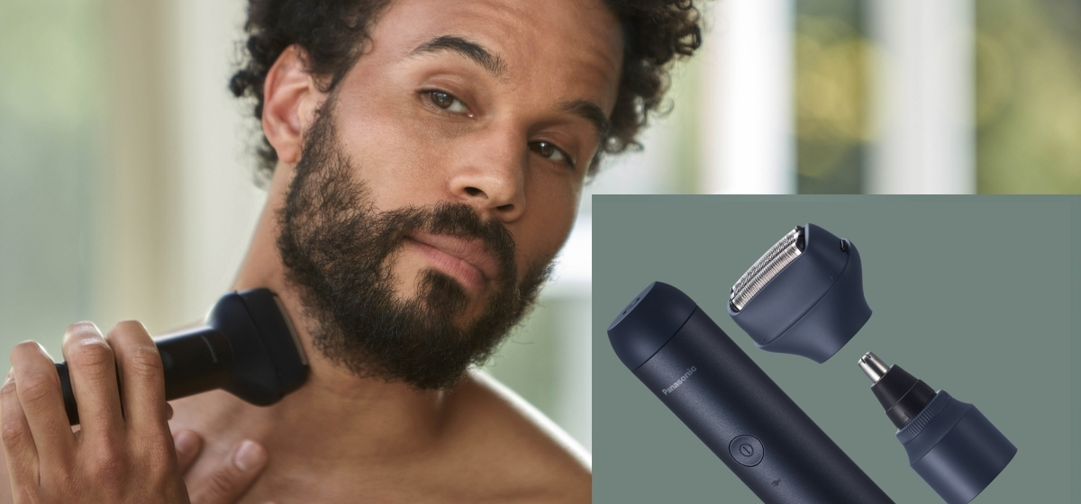 Mężczyzna goli szyję golarką elektryczną. Zestaw do pielęgnacji i akcesoria.