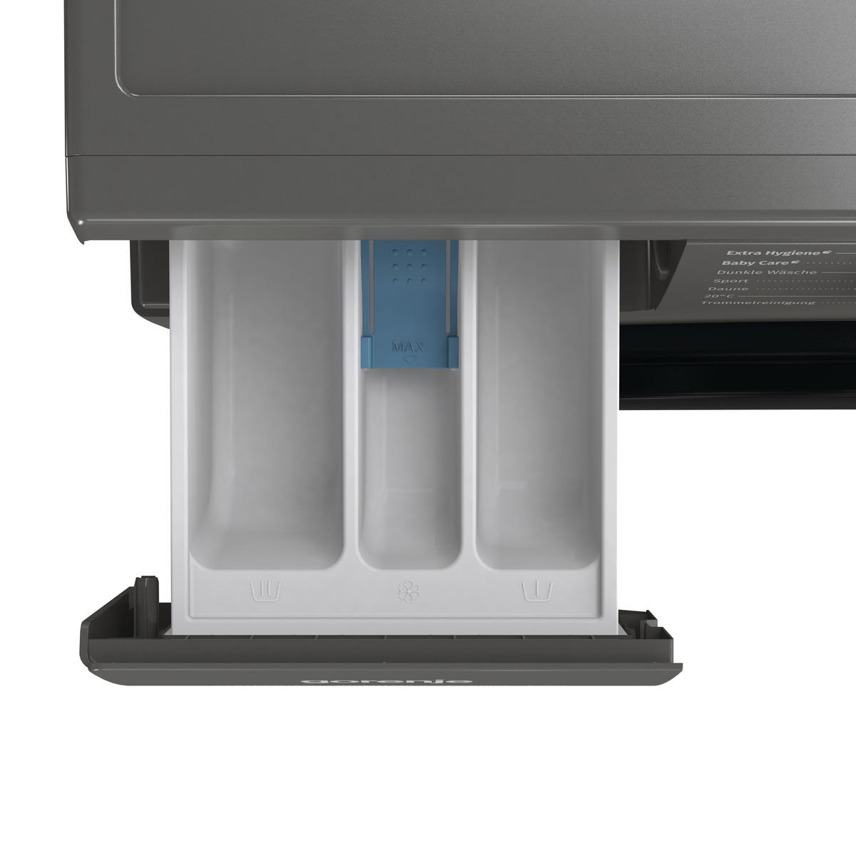Eine Waschmittelkammer mit drei Fächern.