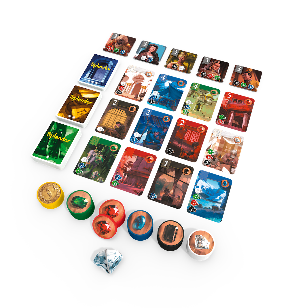 Gra planszowa z kartami, żetonami i diamentem, na czarnej powierzchni, widok z góry.