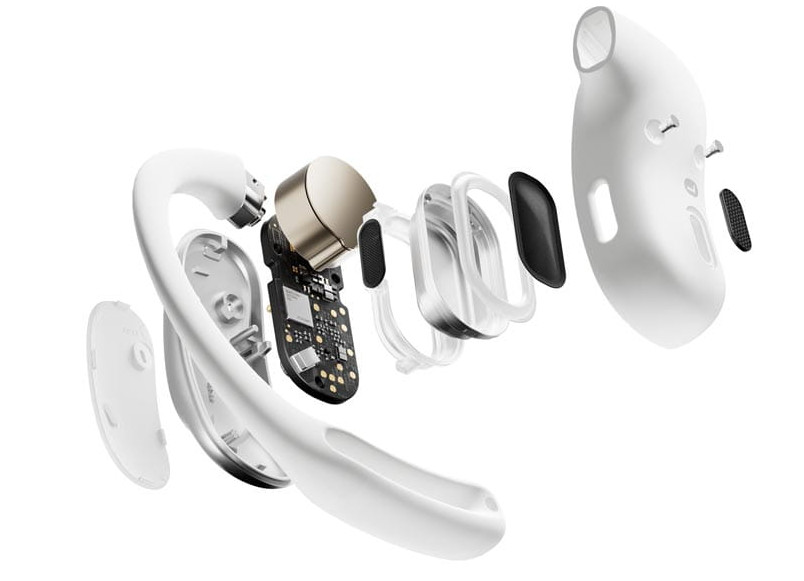 Widok rozłożony białych bezprzewodowych słuchawek, pokazujący elementy wewnętrzne. Izolowane na białym tle.