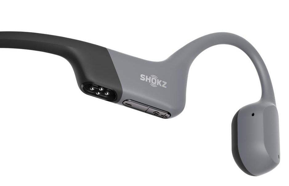Szare i czarne słuchawki Shokz, zbliżenie, białe tło.