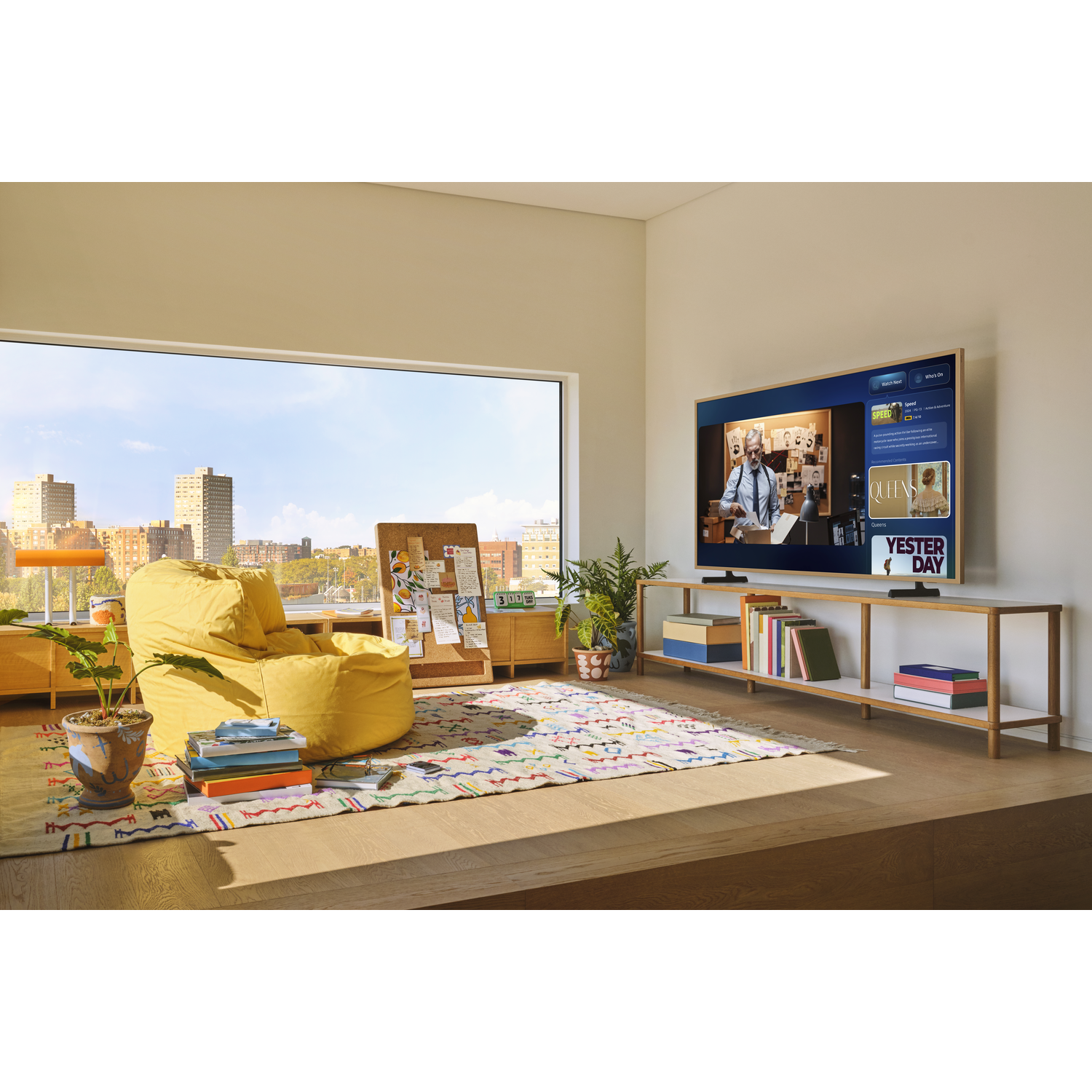 Modern living room with large TV, yellow beanbag, window view of city.