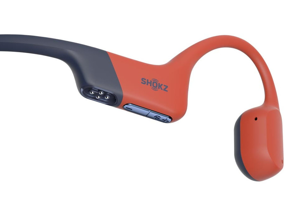 Pomarańczowe i szare słuchawki Shokz w zbliżeniu.