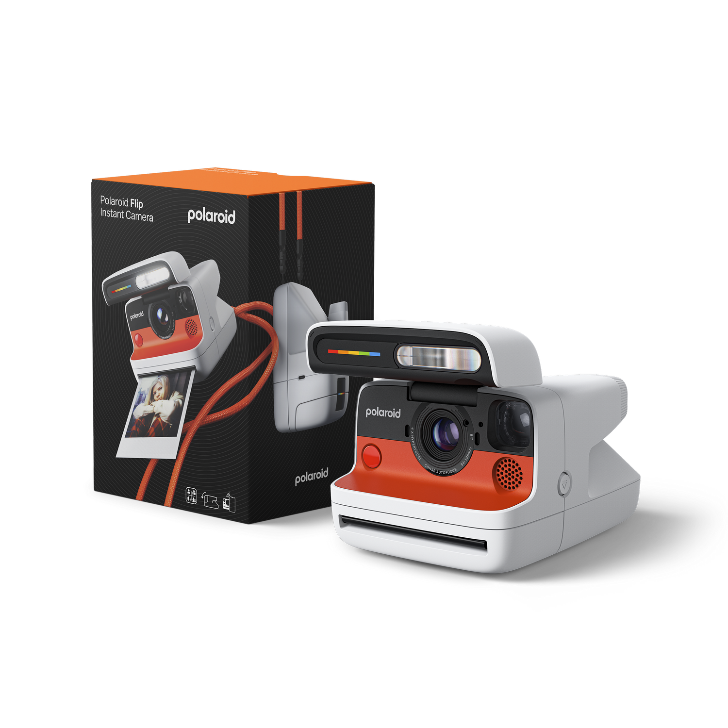 Cámara Polaroid con caja, colores naranja y blanco, con una impresión fotográfica.