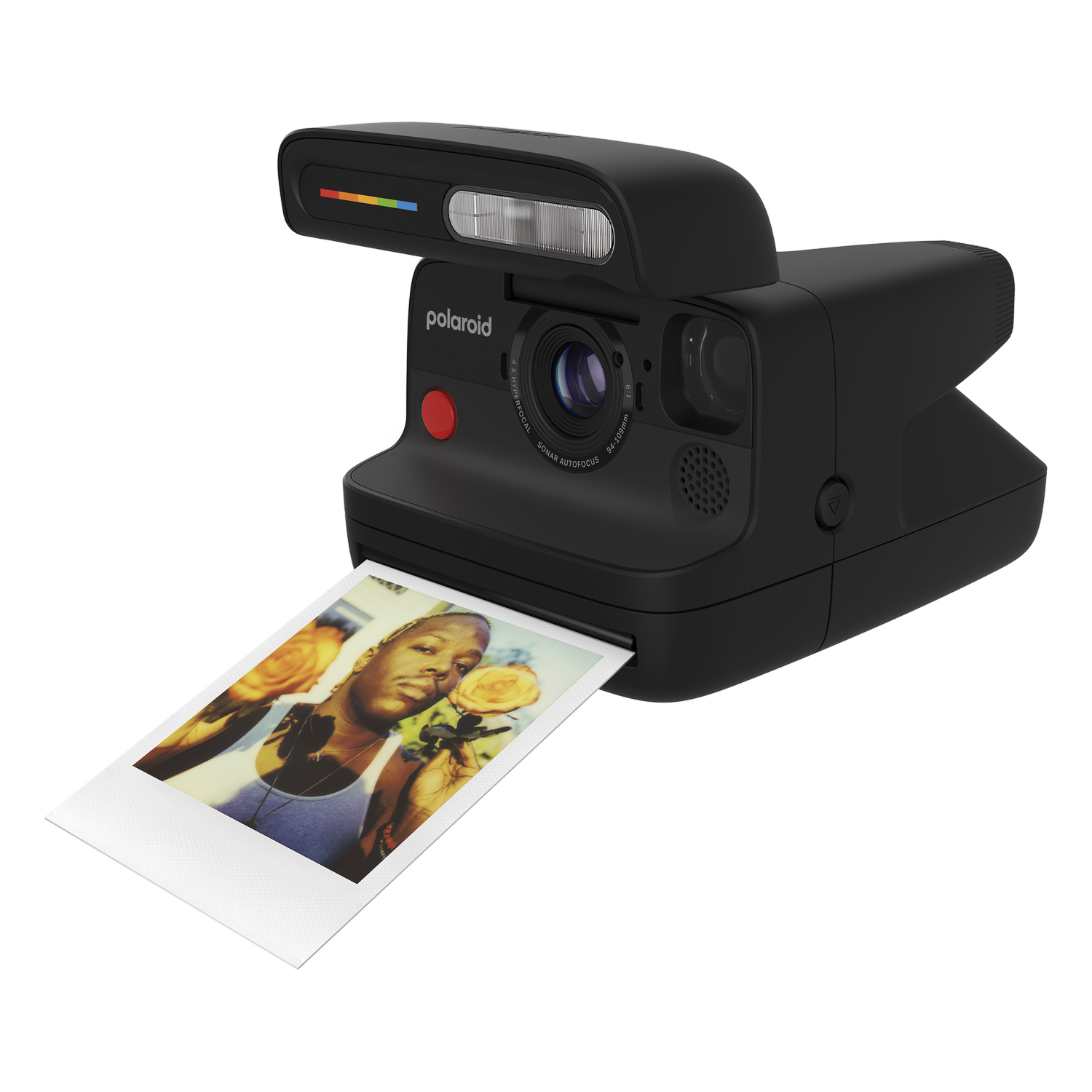 Una cámara Polaroid negra con una foto saliendo de la cámara.