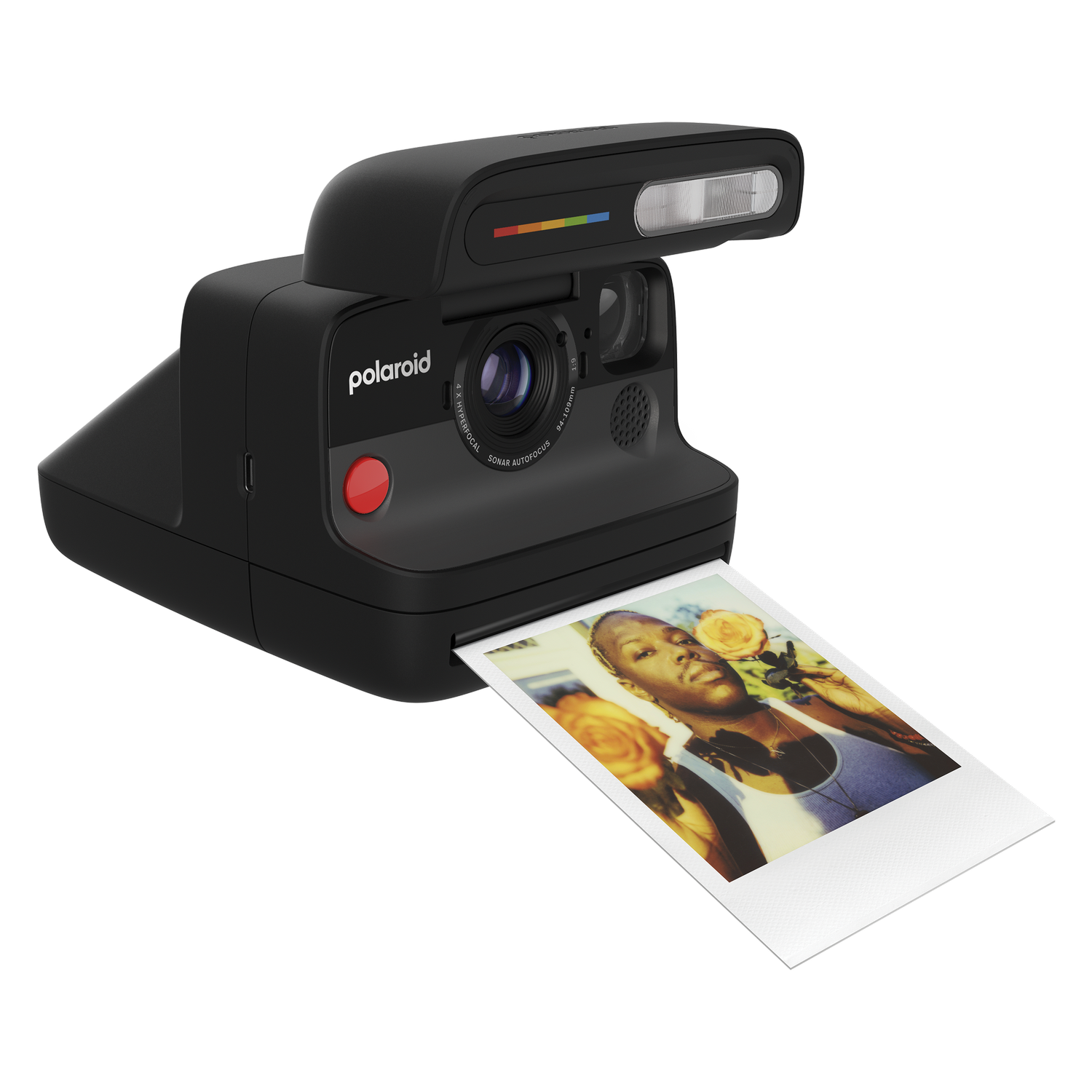 Cámara Polaroid negra con una foto de una mujer.