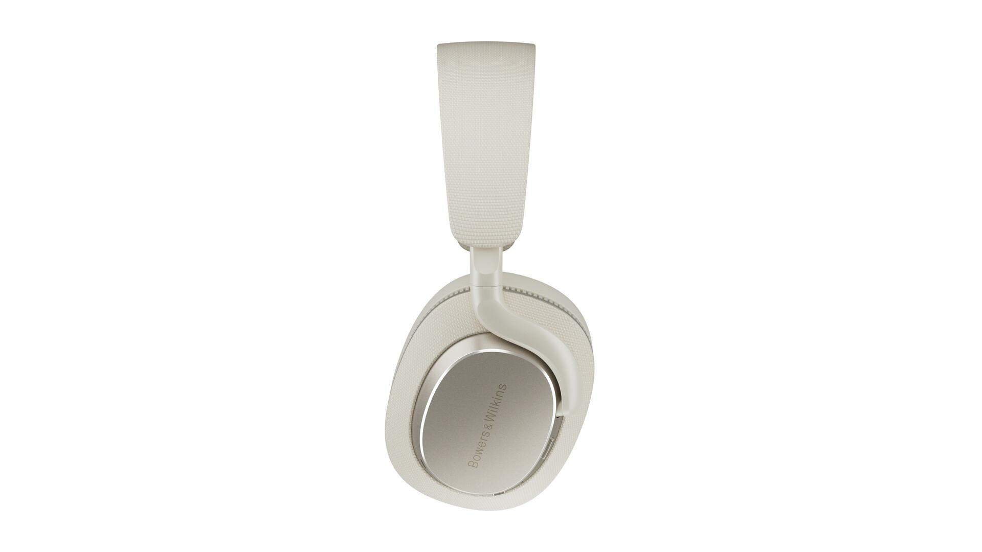 Cremefarbene Bowers & Wilkins Kopfhörer, Seitenansicht, vor weißem Hintergrund.