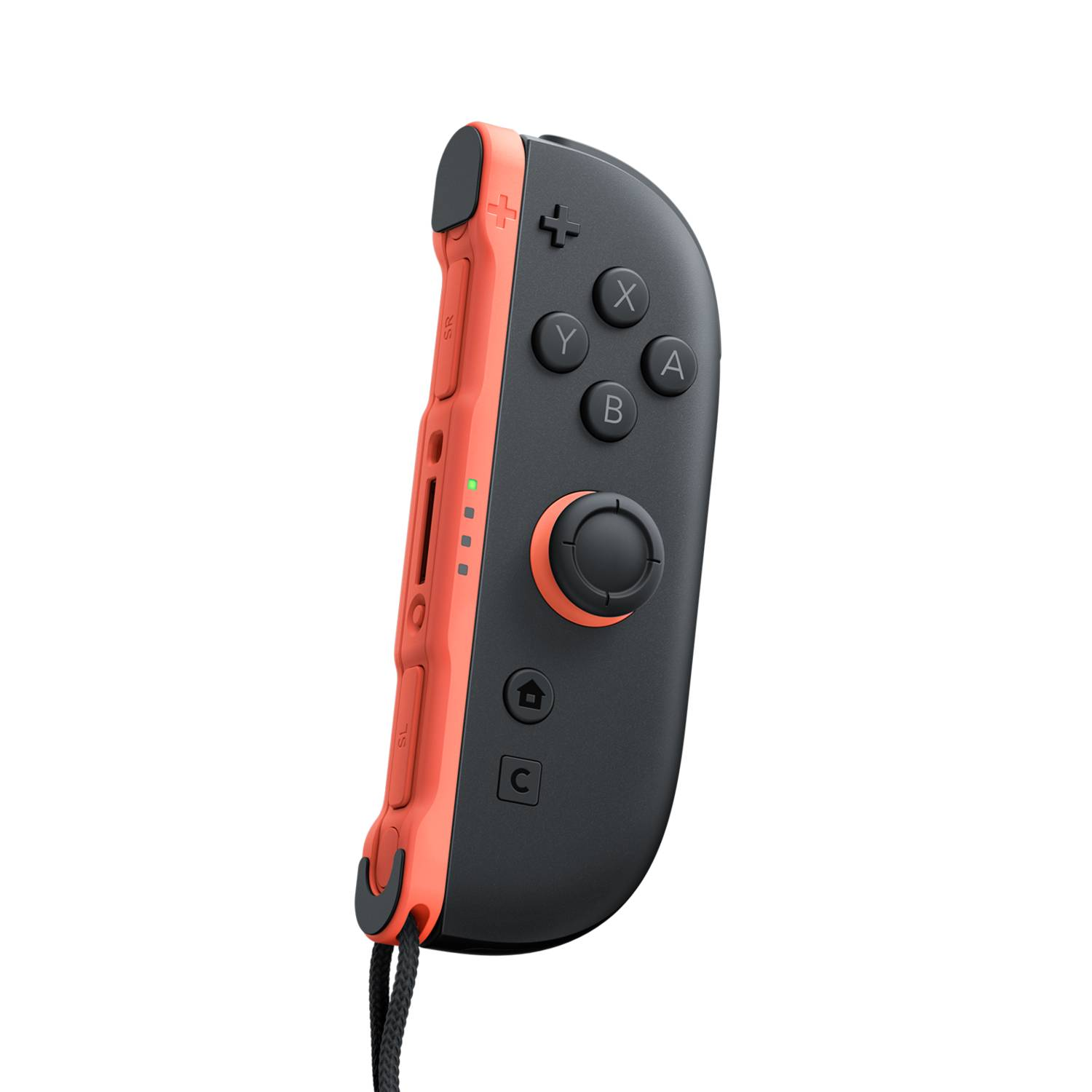 A Switch controller in coral and black. Buttons are visible. A black cord is attached.