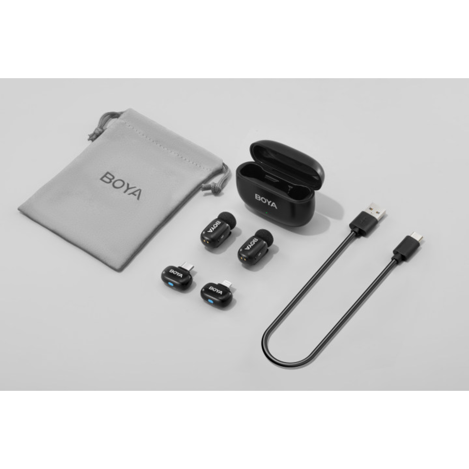 BOYA branded audio equipment, including microphones and a charging case.