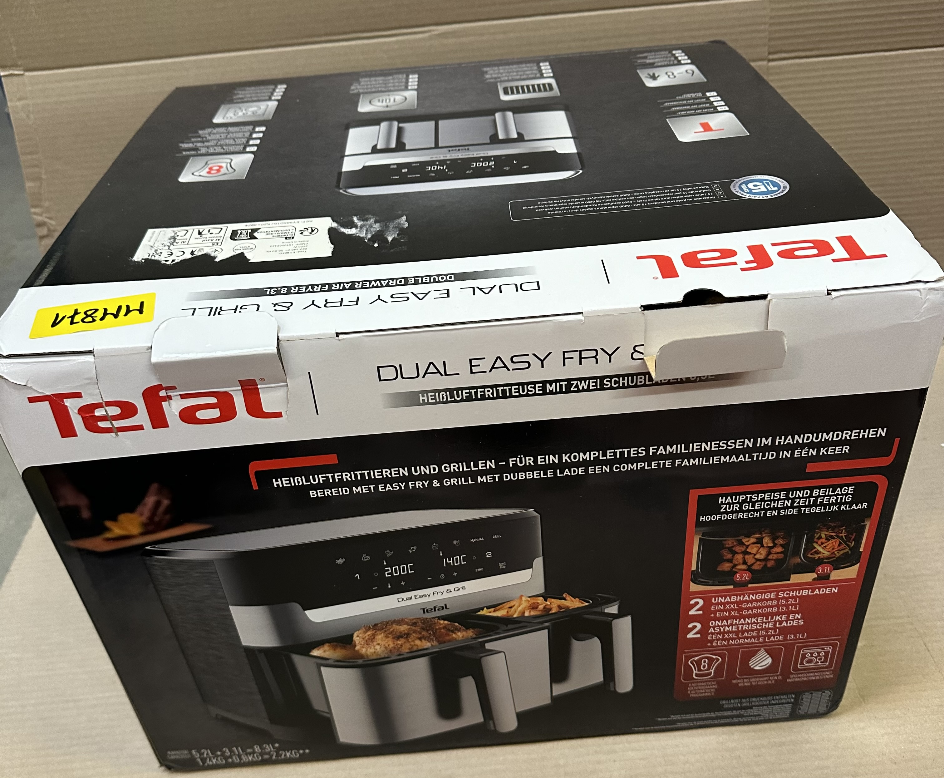 Pudełko Tefal Dual Easy Fry & Grill, ze zdjęciem produktu z przodu.