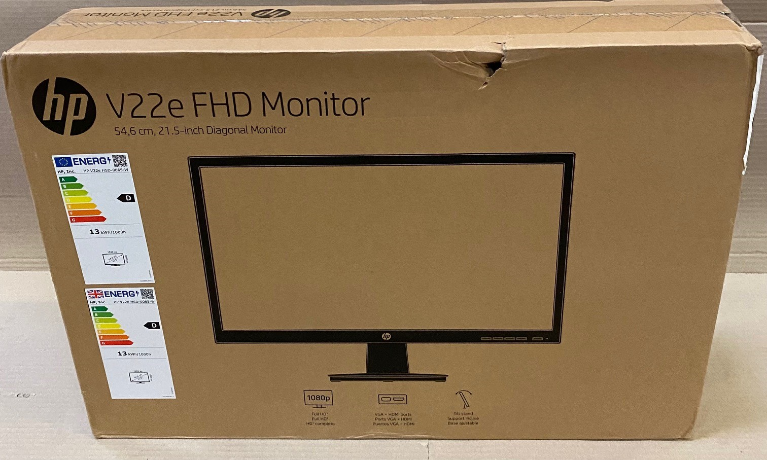 Brązowe pudełko z czarnym monitorem w środku.