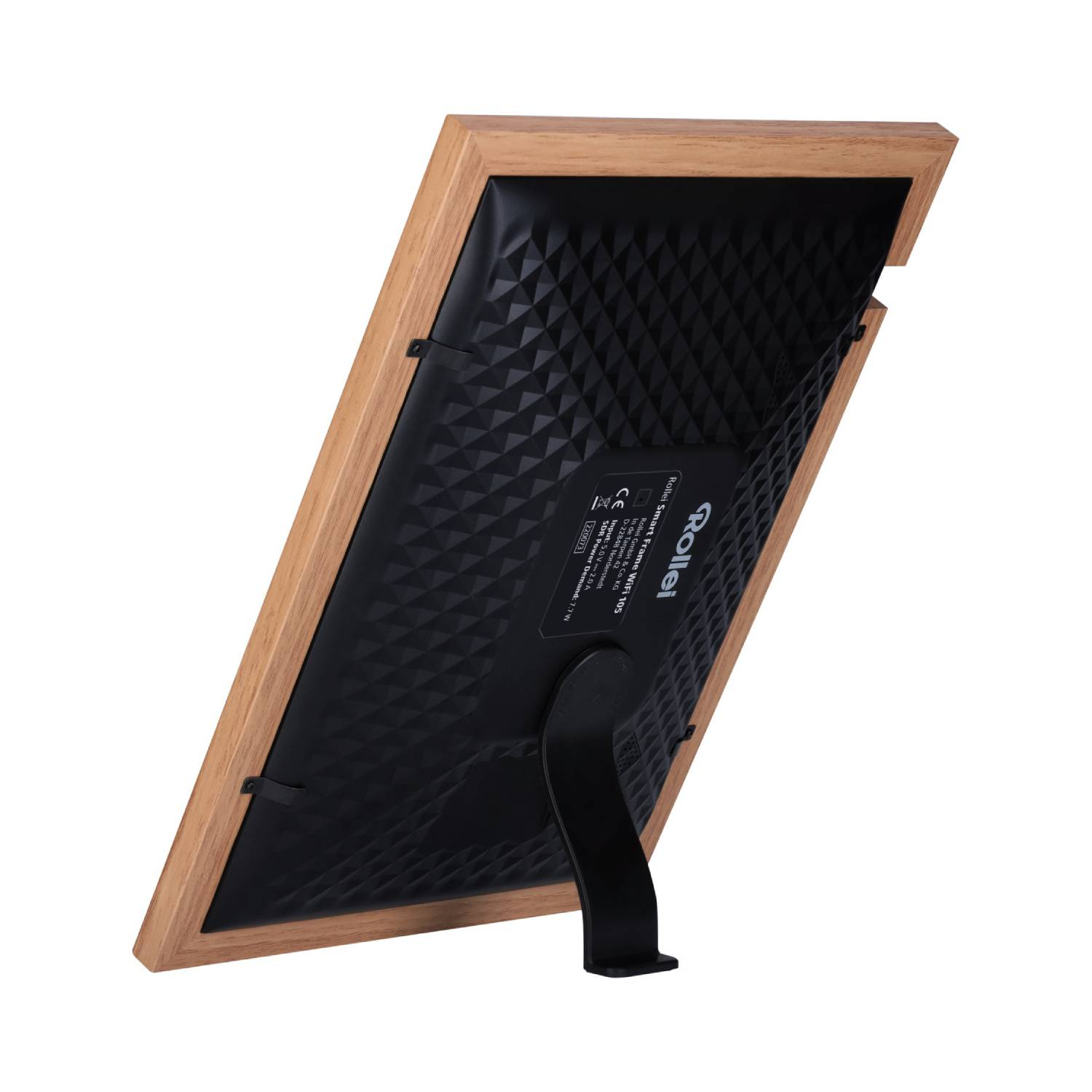 A wooden photo frame seen from the back, with a black patterned surface and a stand.