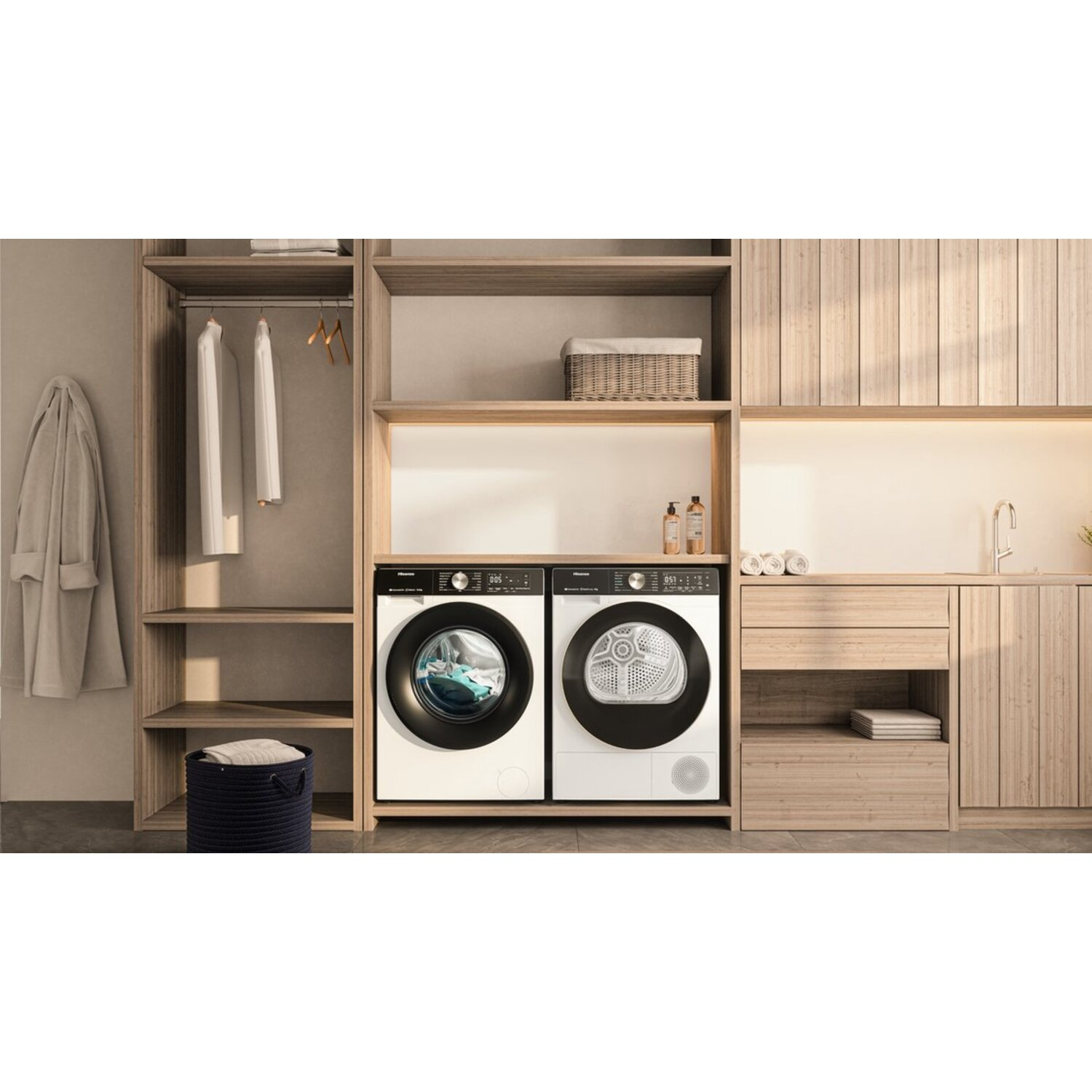 A laundry room with a washer and dryer. The room is made of light-colored wood.