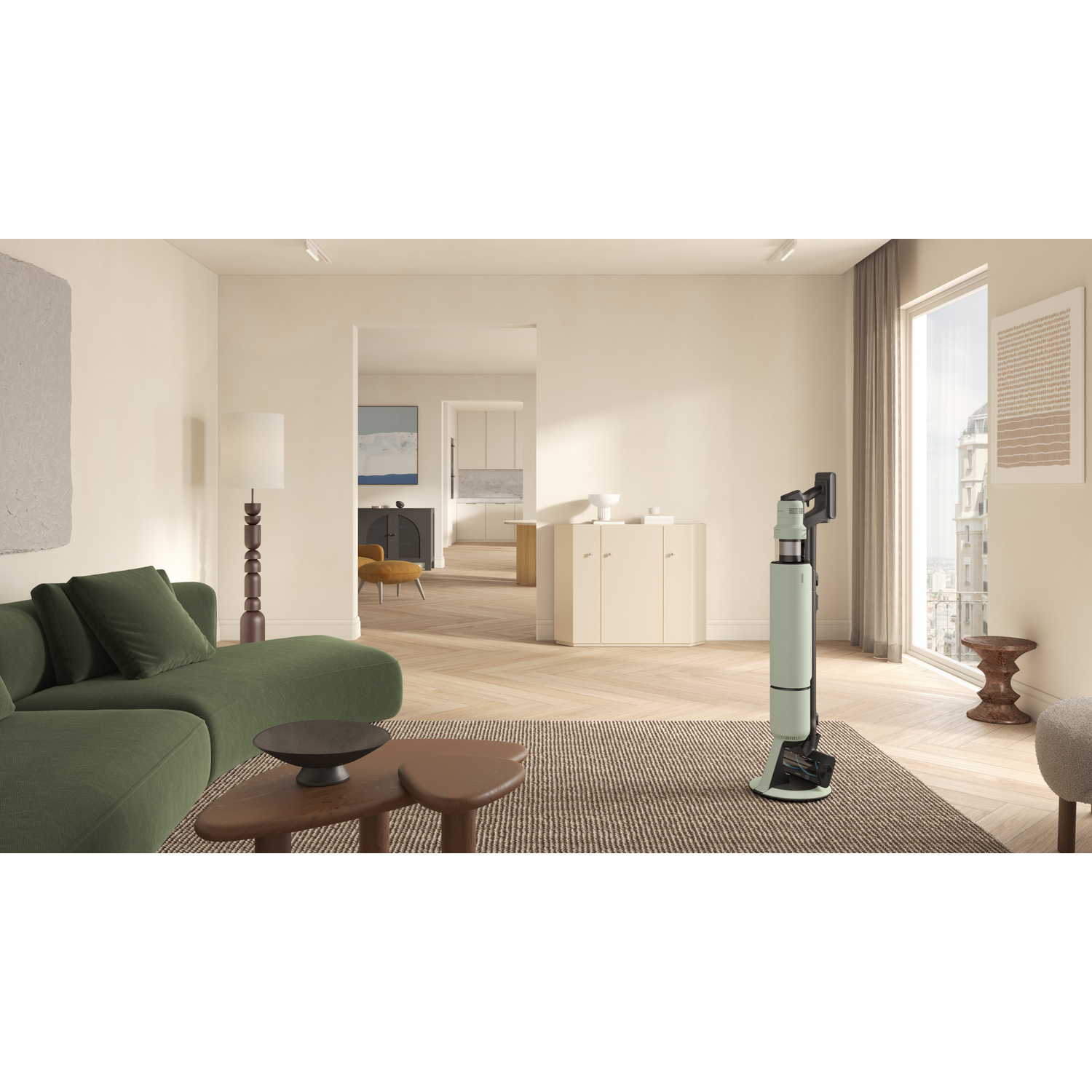 A modern living room with a green couch, a rug, and a vacuum cleaner.