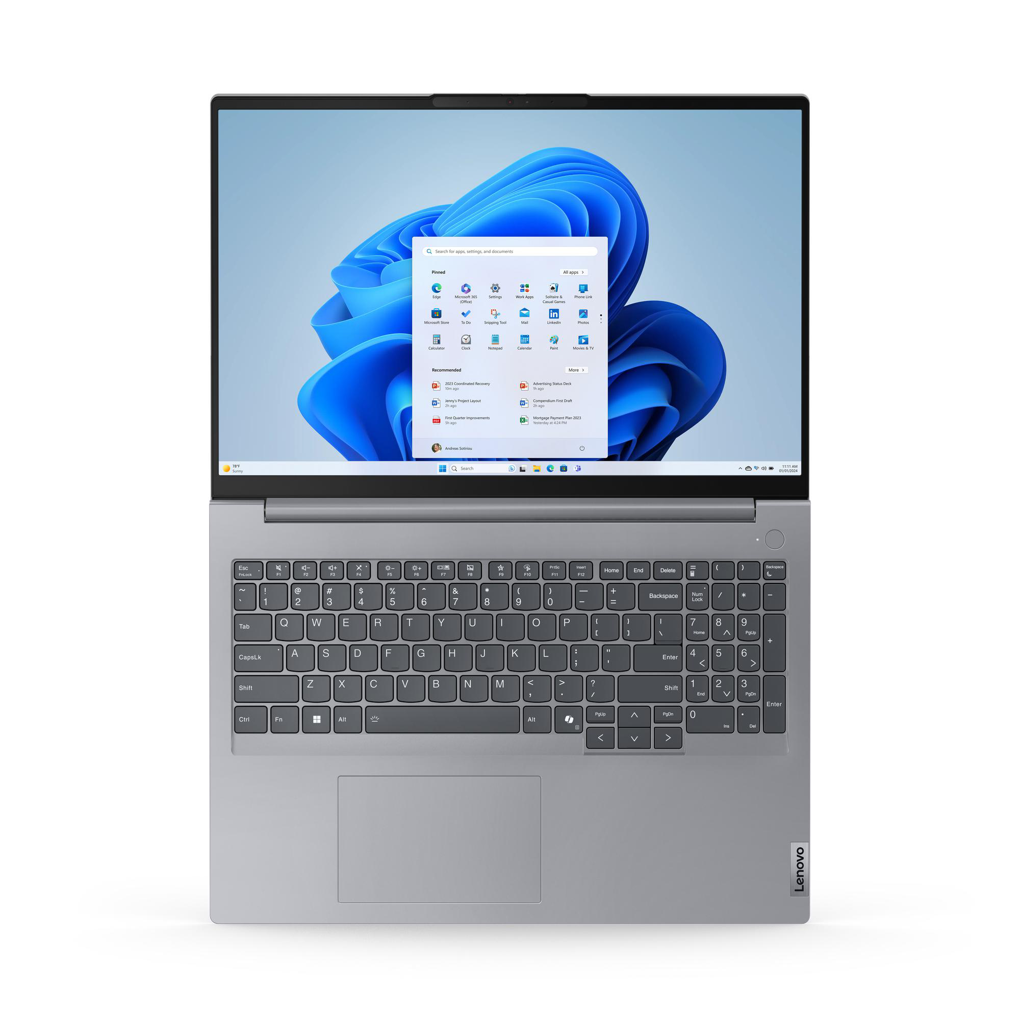 Laptop, Draufsicht, geöffnet, zeigt den Windows 11 Desktop. Graues Gehäuse.