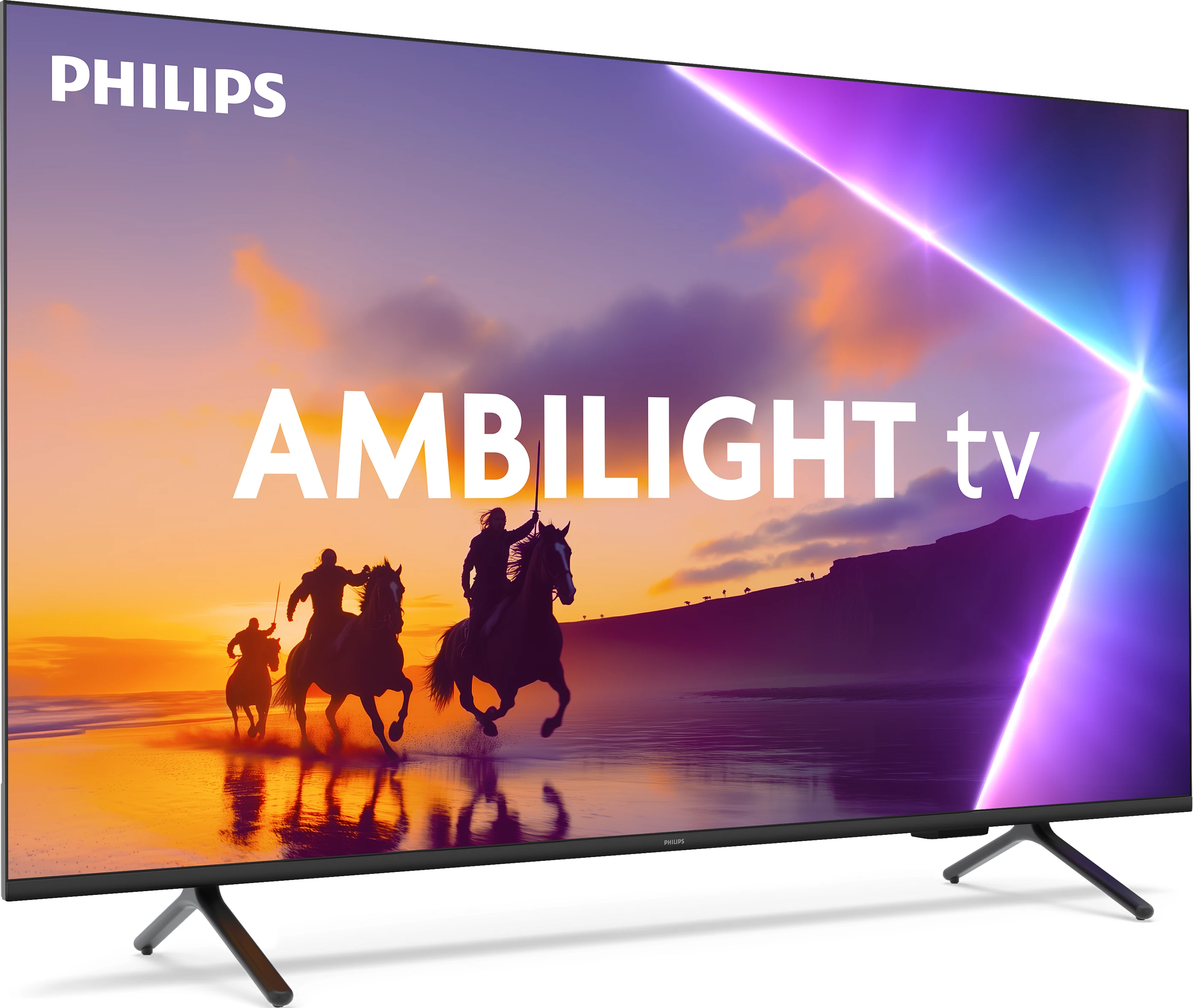 Un televisore Philips Ambilight mostra una scena di tramonto con cavalieri a cavallo. Il televisore ha una cornice nera e un supporto.