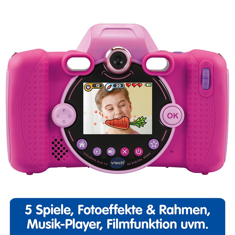 Una fotocamera digitale rosa per bambini, che mostra un bambino con una carota in bocca sullo schermo.