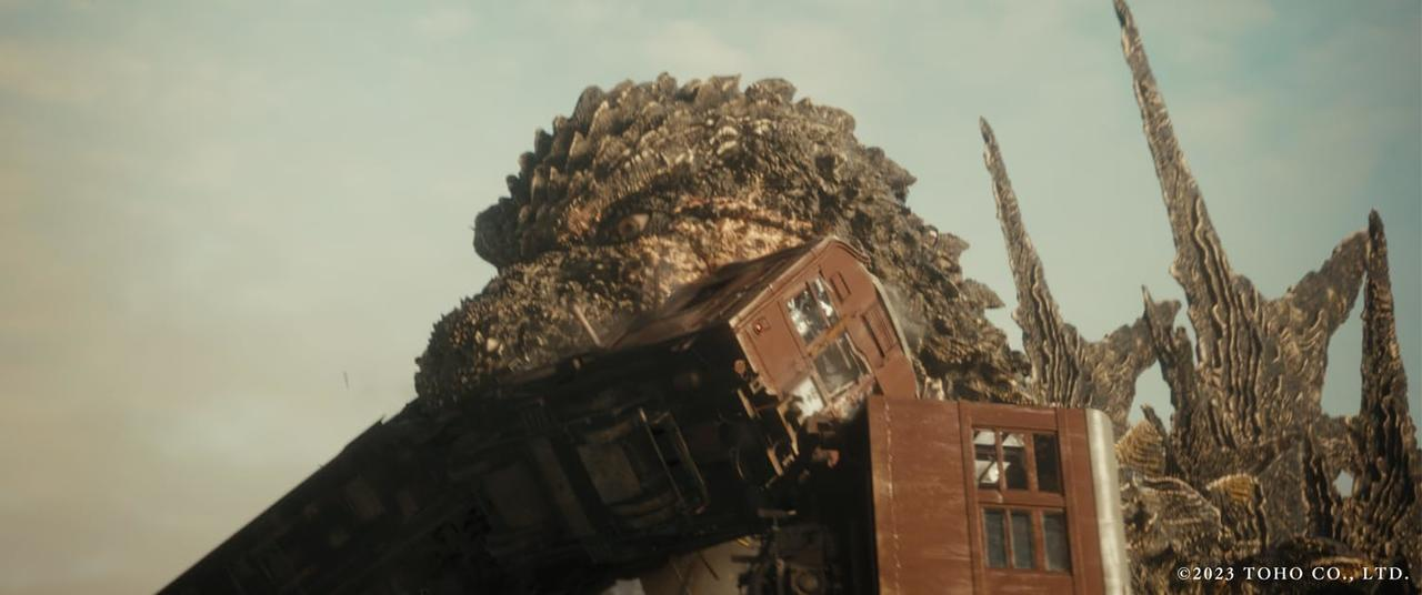 Godzilla zerstört einen Zug.
