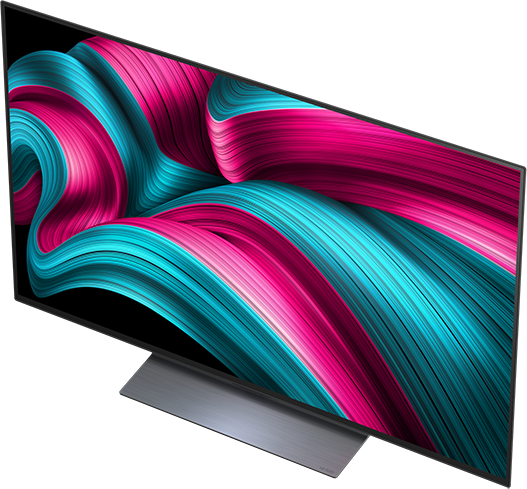TV színes, absztrakt designnal a képernyőn, szögben, fekete állványon.