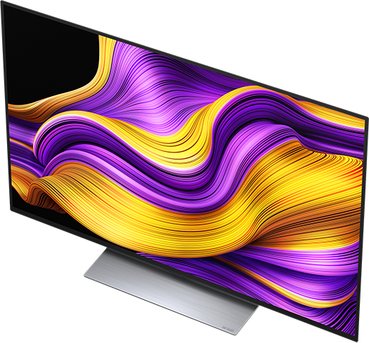 Egy modern LG OLED TV egy élénk absztrakt műalkotást jelenít meg lila, sárga és narancs színekben.