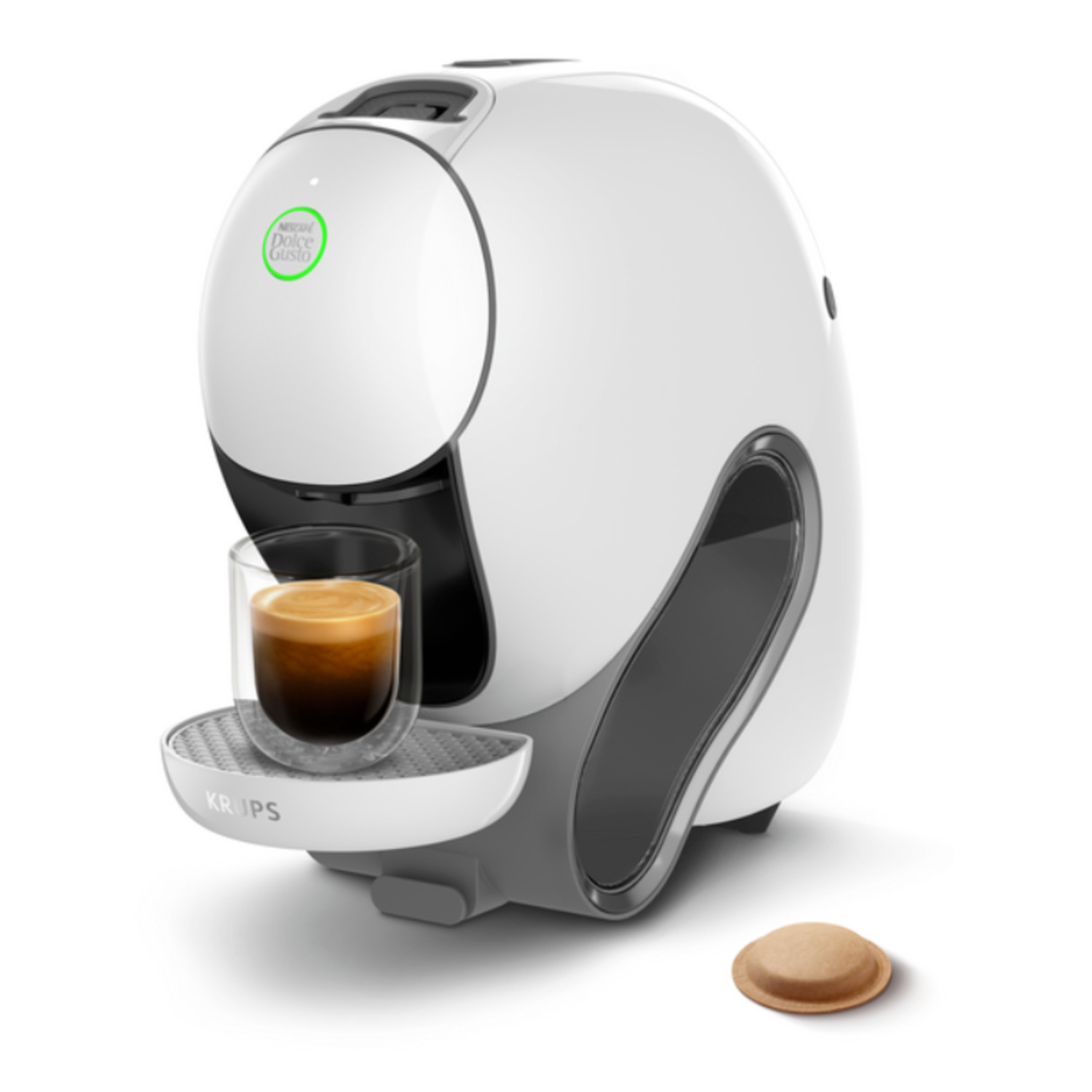 Een witte en grijze Dolce Gusto koffiemachine met een glas koffie, een koffiepad en het Krups logo.