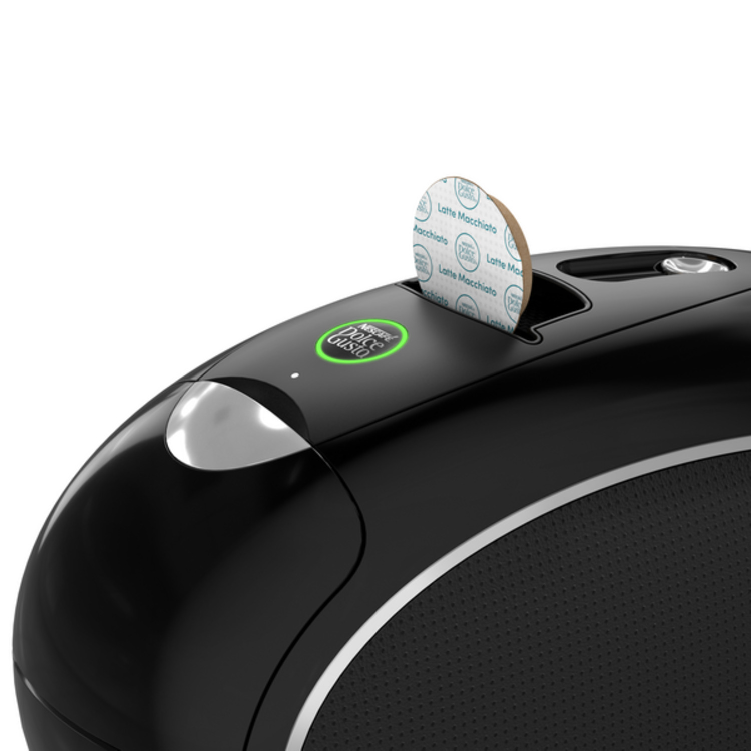 Een zwarte Dolce Gusto koffiemachine met een Latte Macchiato capsule erin. De machine heeft een zilveren rand en een groen logo.